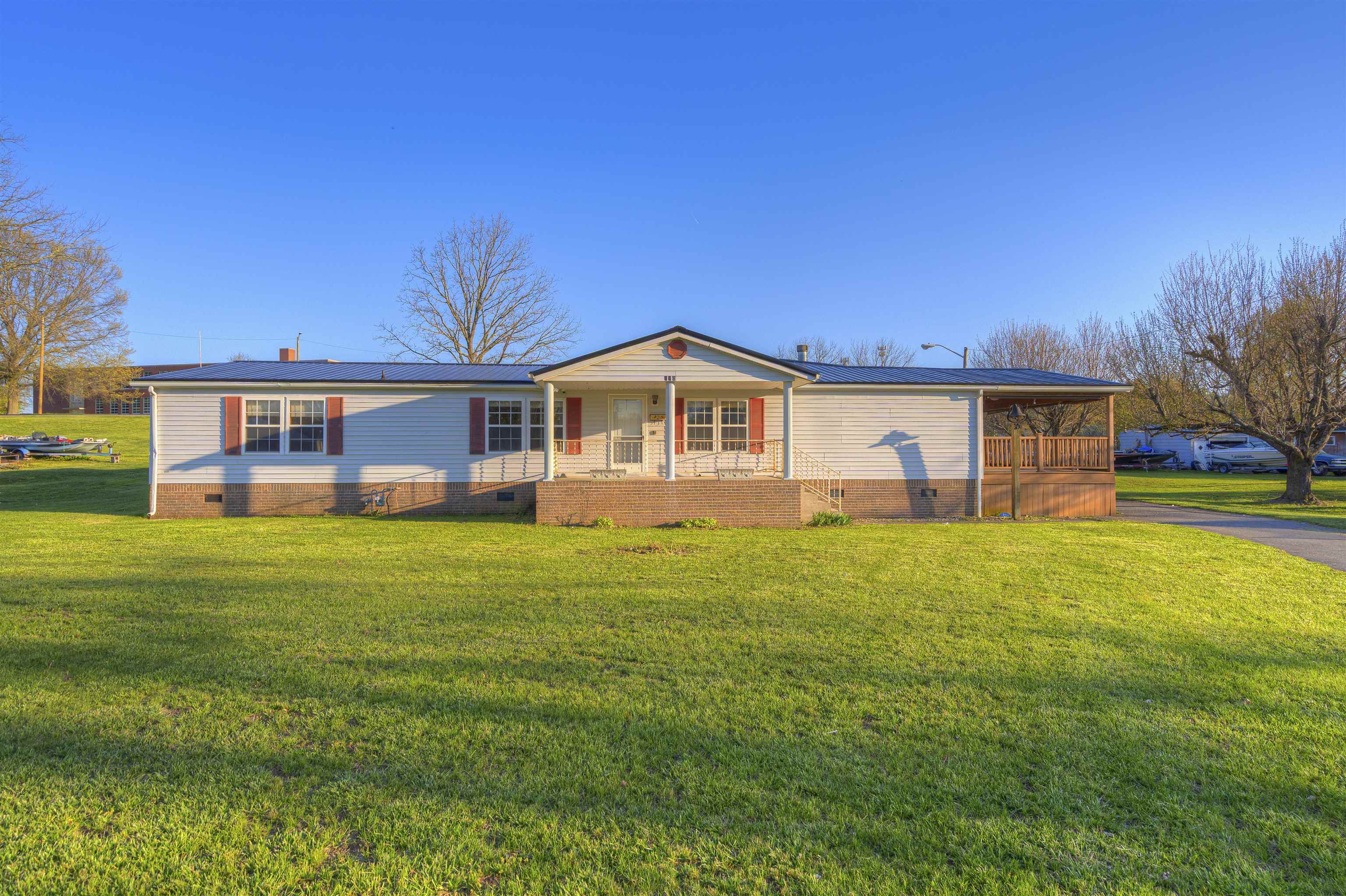 Welcome to 840 Newbern Rd — a beautifully updated 4-bedroom, 3-bath home with a bright open floorplan and abundant natural light. Featuring two large primary suites with walk-in closets, this home offers flexible living and plenty of space. The updated kitchen includes new countertops, backsplash, and a large stainless sink. Enjoy new LVP flooring and fresh paint throughout. Step outside to a spacious covered porch, perfect for relaxing or entertaining, overlooking a level lot with a fenced area. A double detached garage adds convenience and storage. Move-in ready and full of charm!