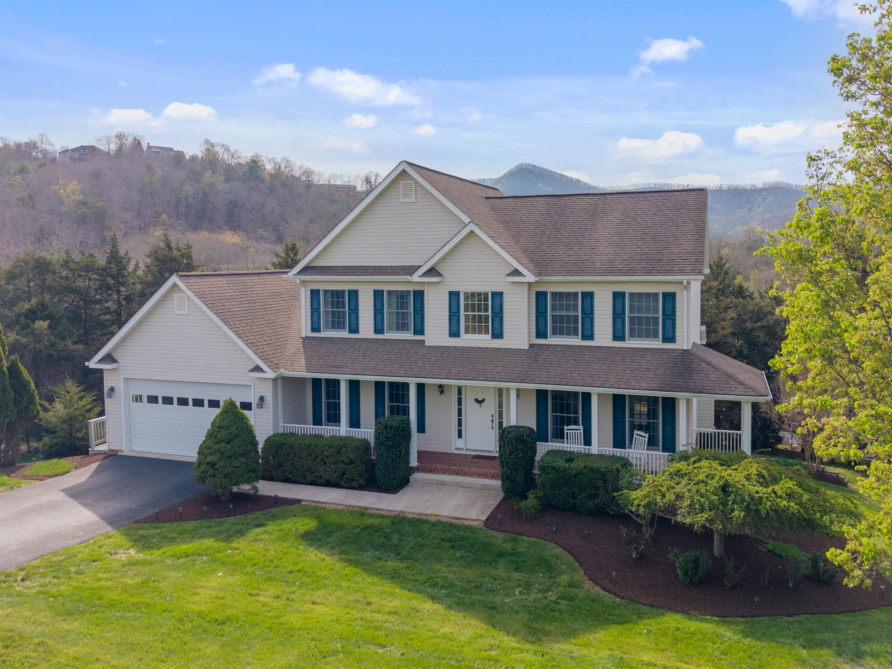 Set within the highly regarded Blacksburg Country Club community, this home offers a refined blend of comfort, thoughtful design, and everyday livability, enhanced by a beautiful mountain view that adds to its sense of setting. The custom kitchen features granite countertops with bar seating and opens to a welcoming gathering space with fireplace and built-ins, creating a natural place for both relaxed evenings and entertaining. Hardwood, tile, and carpet extend throughout the home, while the elevated deck with pergola and a lower-level patio with gas fire pit provide inviting outdoor living spaces. The finished basement also includes wired surround sound and a dedicated workshop with a third garage door. Additional highlights include a whole-home generator and recent updates to the fireplace, microwave, well pump and pressure tank, and garage opener.