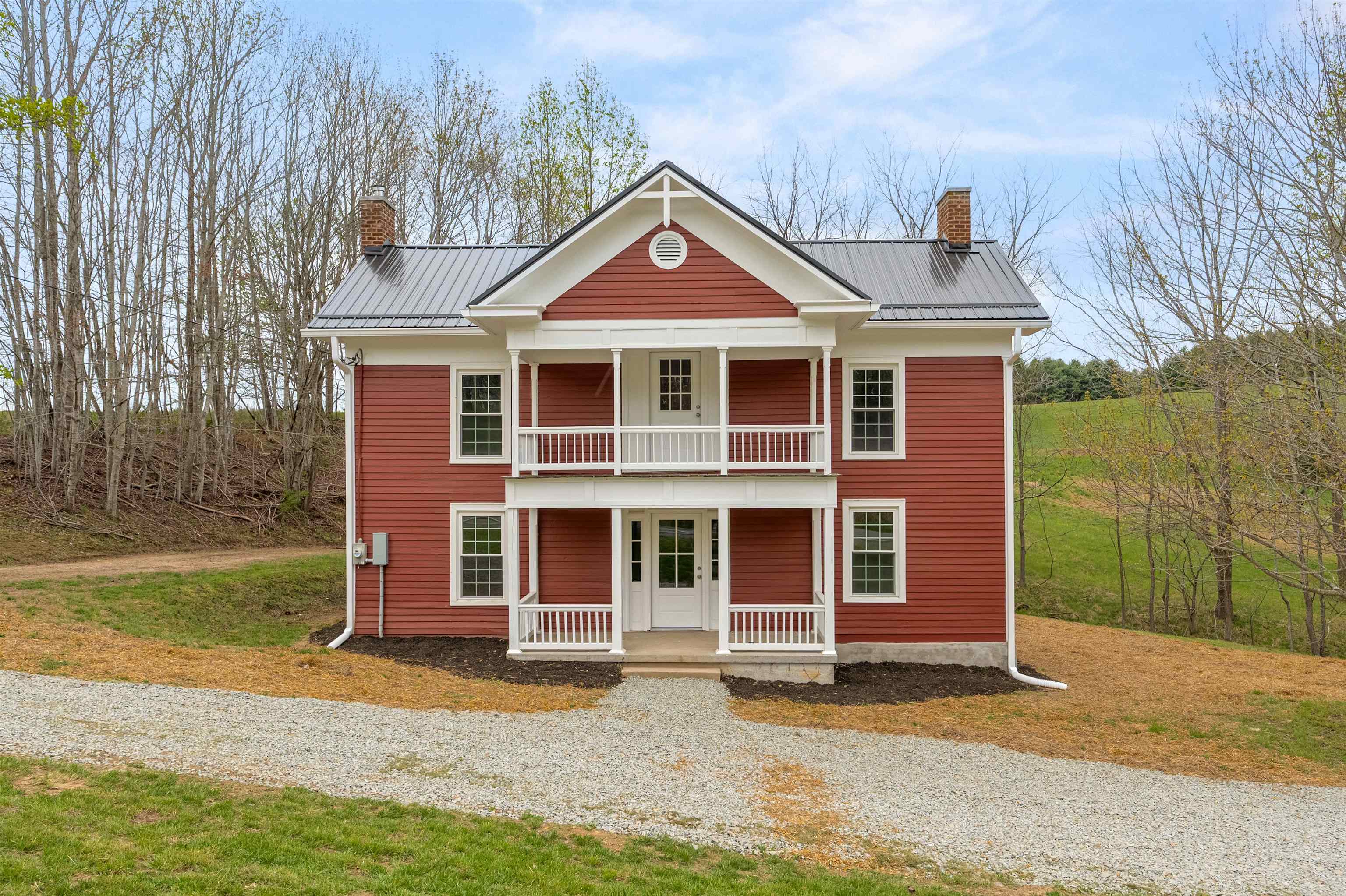 This historic Floyd home has been thoughtfully renovated to blend farmhouse details like original hardwoods & masonry with modern touches like open living spaces & noise dampening insulation that improves energy efficiency-all on 2 acres! Walking through the front door, you'll see gleaming new hardwoods, the original restored staircase, & a view of the open living & dining spaces. The kitchen, with new cabinetry, granite countertops, & tile backsplash, opens to a covered deck for outdoor dining & relaxing! The main floor also has a bedroom, a full bathroom with laundry, & a pantry for additional storage. Upstairs, you’ll find original refinished hardwoods in the hall & the entry to the charming upstairs balcony. The spacious primary suite has a gorgeous bathroom with a custom tile shower & soaking tub. You’ll also find two large bedrooms & 3rd full bath. The home has new two-zone heat pumps, along with a sleek black metal roof& a freshly painted exterior for some fantastic curb appeal!