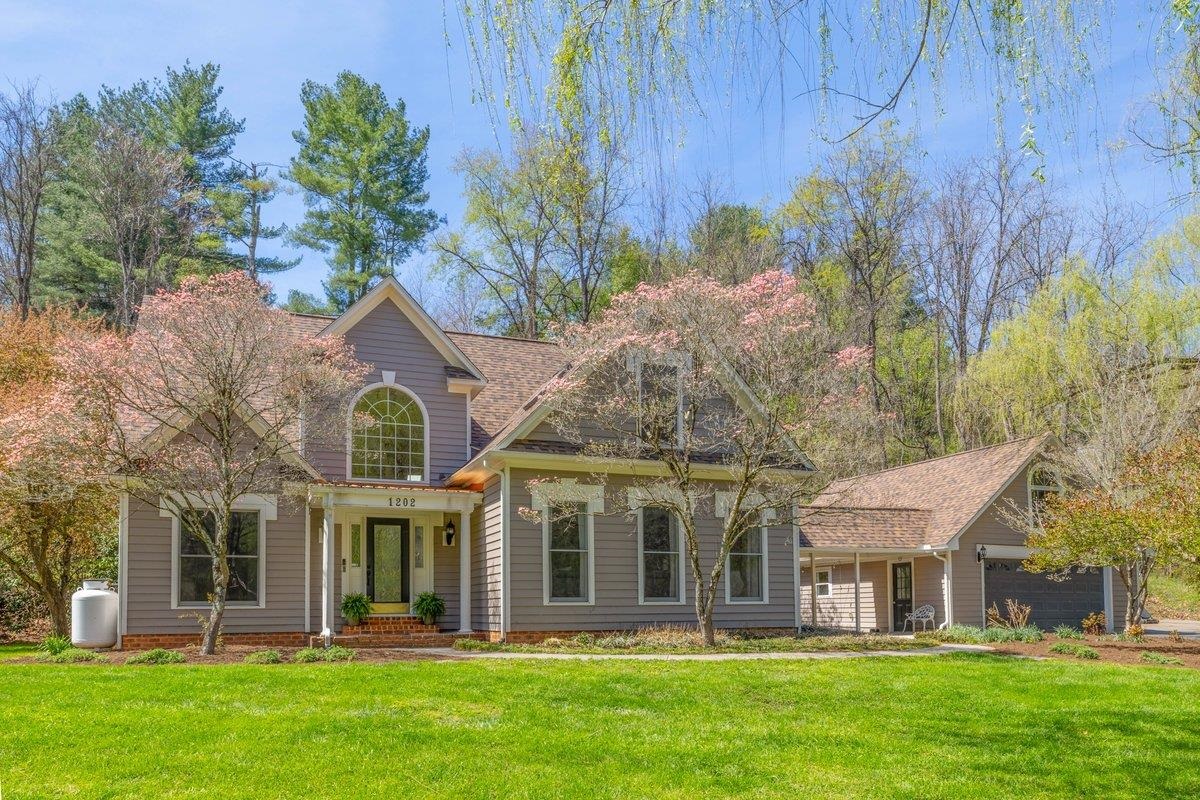 Rare opportunity to own a truly one of a kind home on nearly a 1 acre lot all within Radford city limits. You're certain to be torn between spending your days outdoors, enjoying the creek that runs through the front yard, tending to your chickens or spending the evening around the firepit. While on the inside, newly refinished hardwoods will lead you to this show stopping kitchen, draped in luxury with leathered marble countertops with waterfall edge, walk-in pantry, custom brick range hood and 6 burner gas range. The primary suite is located on the main level featuring tray ceilings, spacious bathroom and lots of natural light. Again, on the main level you'll find an expansive living room complete with custom built-ins. Upstairs are 3 distinctly unique bedrooms and a thoughtfully designed full bath. Last, but certainly not least is a 2 car garage with a bonus loft, perfect for storage or future rec room. Don't miss your opportunity to own one of the most unique properties in Radford!