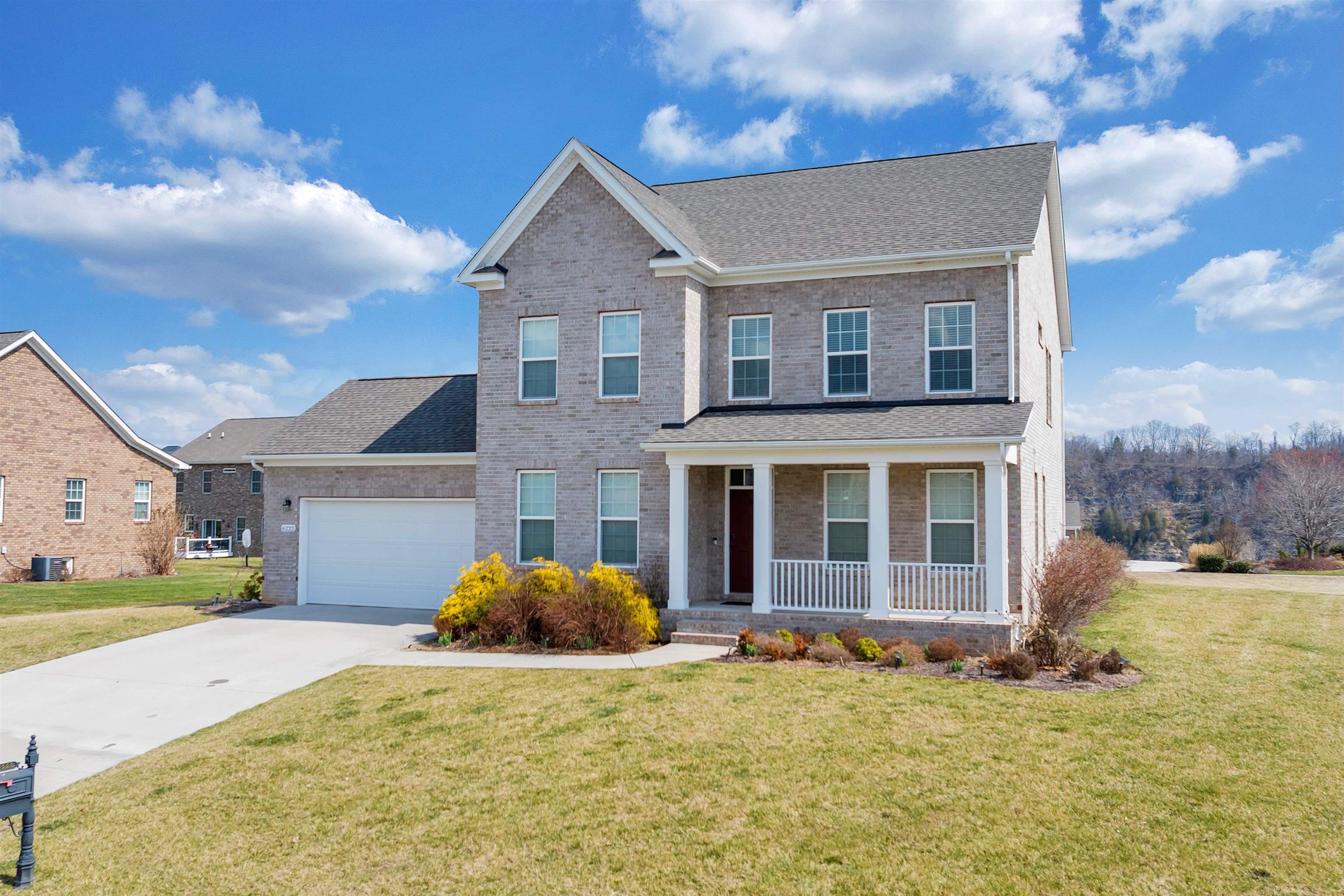 Perched in the prestigious Heron’s Landing community, this exceptional all-brick home offers views of the New River, the renowned Pete Dye golf course, and the surrounding Blue Ridge Mountains. Designed for both elegant living and effortless entertaining, this two-story home with a finished basement seamlessly blends timeless craftsmanship with modern comfort. The main level showcases rich hardwood flooring and an expansive open-concept layout, anchored by the kitchen featuring generous workspace, a sunlit breakfast nook, and seamless flow into the living and dining areas. With 5 spacious bedrooms and 3 and a half baths, the home provides both privacy and flexibility for family and guests. The lower level is an entertainer’s dream, offering a large recreation space, additional bedroom, and full bath. Perfect for hosting guests. Residents enjoy a beautiful walkable neighborhood and near by amenities including world-class Pete Dye golf along the New River.