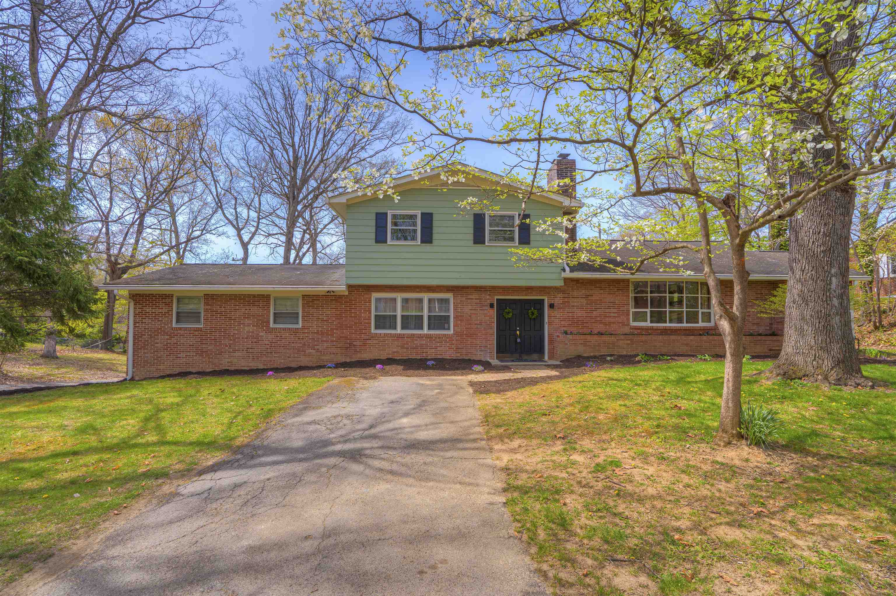 Welcome to 345 Overhill Drive in Christiansburg—a 5-bedroom, 3 full bath home ready for its next owners to make it their own. Spacious living areas and large windows fill the home with natural light, while the updated primary bathroom adds a modern touch.  Near the kitchen, additional storage space offers the potential for an oversized pantry. The lower level features a double garage and a dedicated workshop, perfect for projects or extra storage.  Situated on a large, flat double lot with established landscaping, this property provides plenty of room to enjoy and endless possibilities to customize. A great opportunity to add your personal touch and build value.