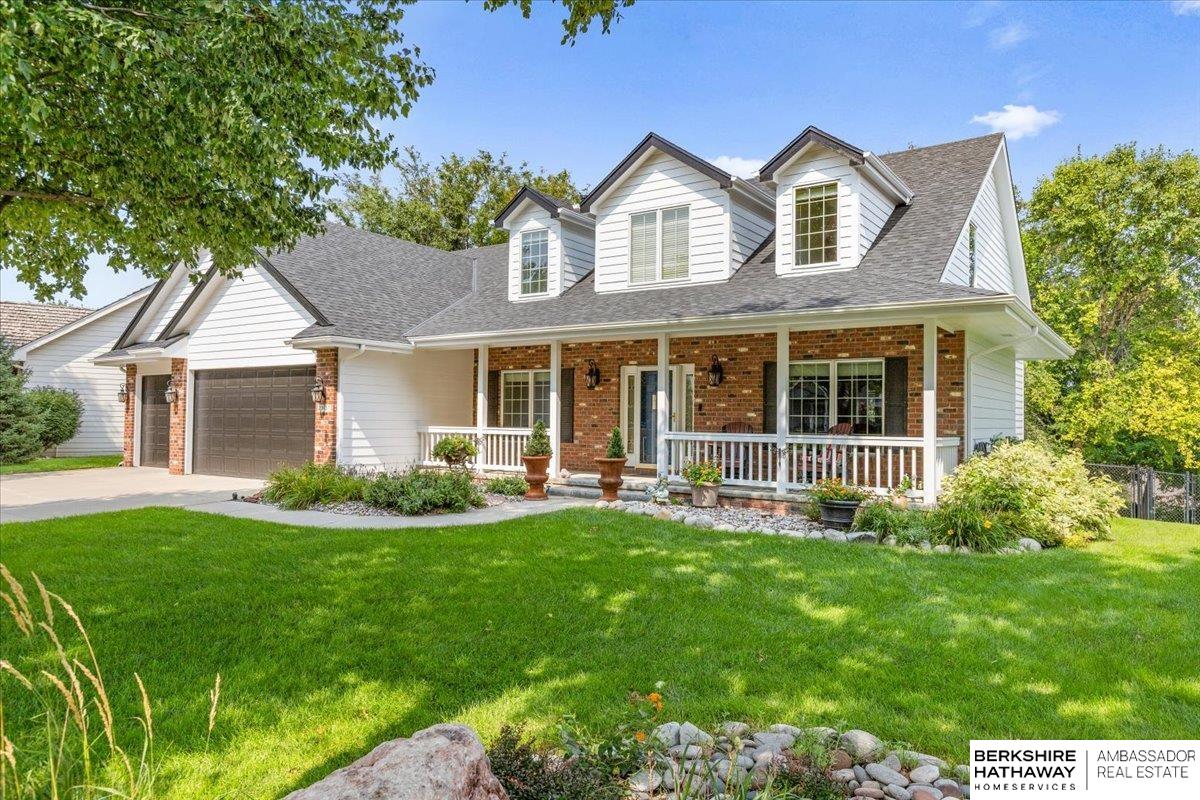 Welcome home to this exceptional 1.5-story residence offering over 5,300 square feet of beautifully finished living space. A dramatic two-story entry welcomes you into a thoughtfully designed floor plan ideal for both everyday living and entertaining. The main-floor primary suite offers ultimate convenience with direct access to the main-floor laundry. Upstairs, two generously sized bedrooms are connected by a spacious Jack & Jill bath. The walk-out lower level functions as a private living retreat, featuring an additional bedroom, a sleek updated ¾ bath, a wet bar perfect for entertaining, a non-conforming bedroom, and a second living area. Step outside to a truly private backyard with no rear neighbors and a relaxing hot tub.Recent updates include new flooring, exterior paint, roof, deck, and many newer appliances. Located in The Ridges, this home offers easy access to Shadow Ridge Country Club and a prime Omaha location close to everything—plus sought-after Elkhorn schools.