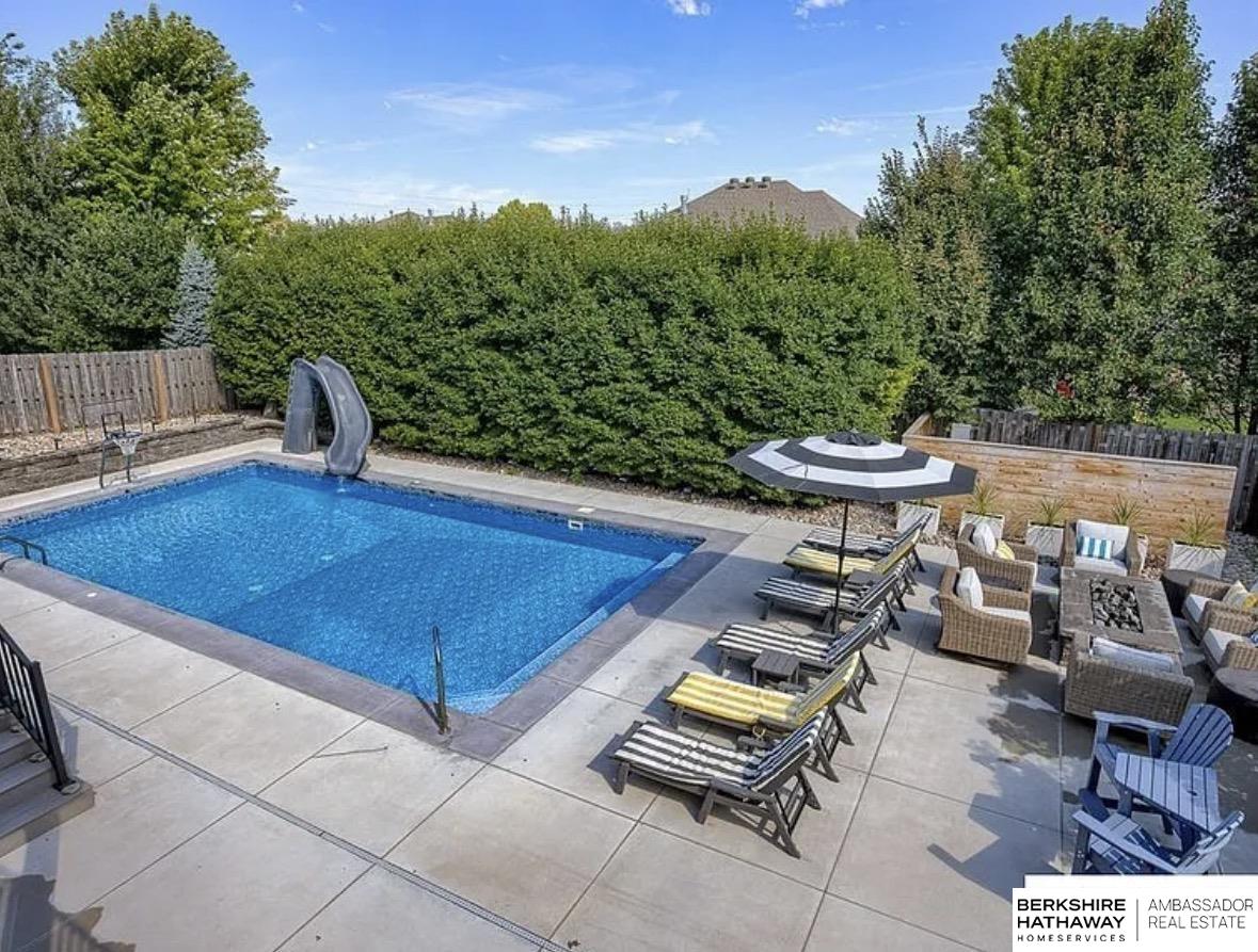 Showings start 02/13/26. ELKHORN SCHOOLS & BACKYARD OASIS WITH POOL! This beautifully updated 2-story home with a walk-out basement is ready for its next chapter. Step into a stunning two-story entry that leads to a versatile formal dining room or home office. The absolutely gorgeous kitchen features quartz countertops, stainless steel appliances, a pantry, and opens seamlessly to the dining area and family room. A cozy hearth room with fireplace offers the perfect place to relax while overlooking the private backyard. Upstairs, you’ll find a spacious primary suite and three additional bedrooms, all with custom closets. Primary suite offers a full attached bath featuring a jetted tub, separate shower, and a large walk-in closet. The walk-out basement provides the ideal space for entertaining or family time. Step outside to your own outdoor oasis, complete with an in-ground pool - perfect for summer fun and gatherings. This home truly has it all!