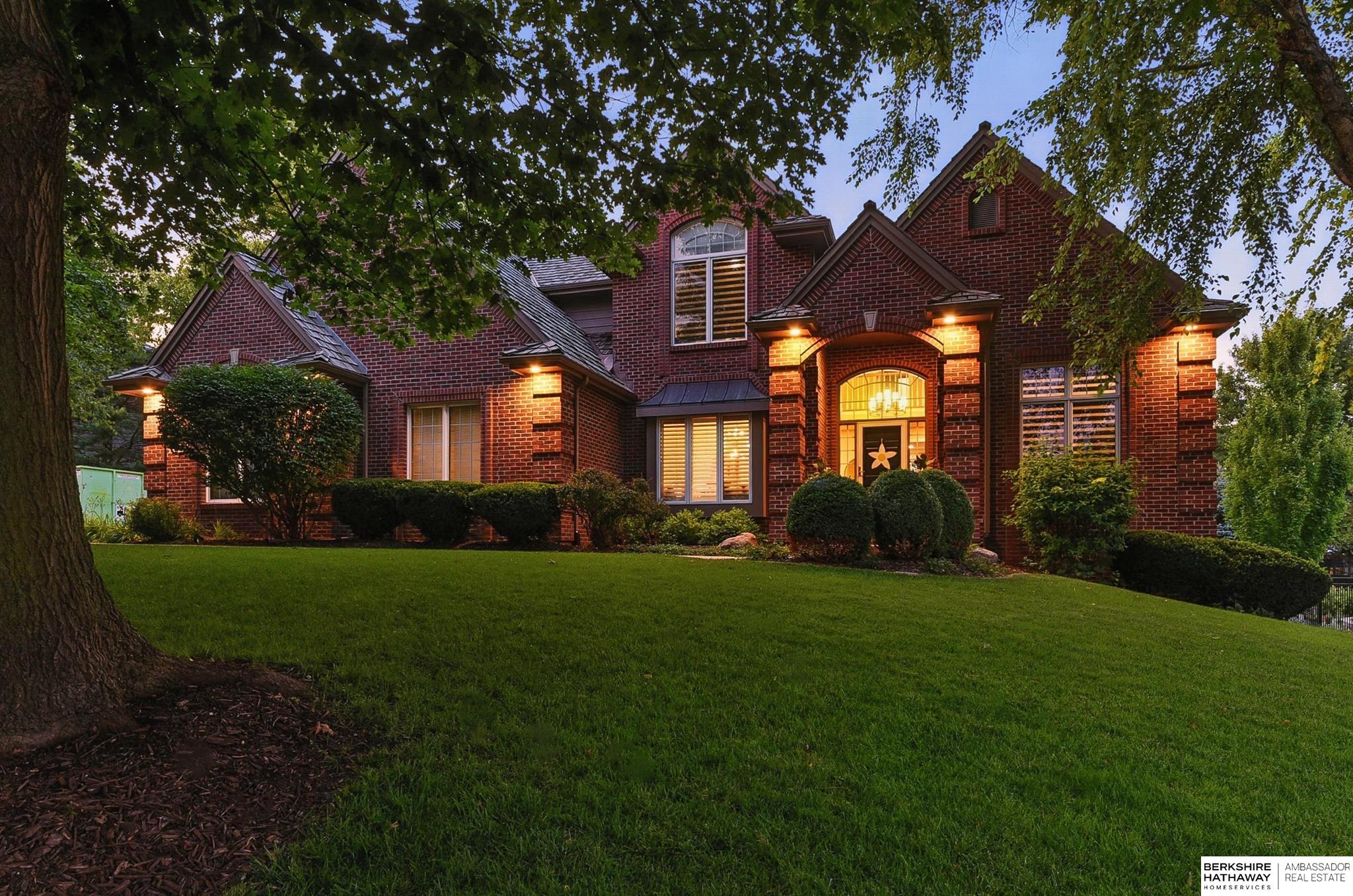 Timeless brick beauty in one of Omaha's most sought-after neighborhoods! Nestled on over a third of an acre and within walking distance to Champions Run Country Club, this stately 2-story offers 4 spacious bedrooms, 5 beautifully appointed bathrooms, and a 3-car garage. Inside, you'll find elegant finishes and thoughtfully designed spaces, including a dedicated office for working from home, a formal dining room for hosting with style, and a sun-filled main living area that blends comfort with sophistication. The finished lower level expands your living options - perfect for entertaining, a home gym, or a cozy movie night retreat, all while enjoying the charm, convenience, and prestige that comes with this remarkable address.