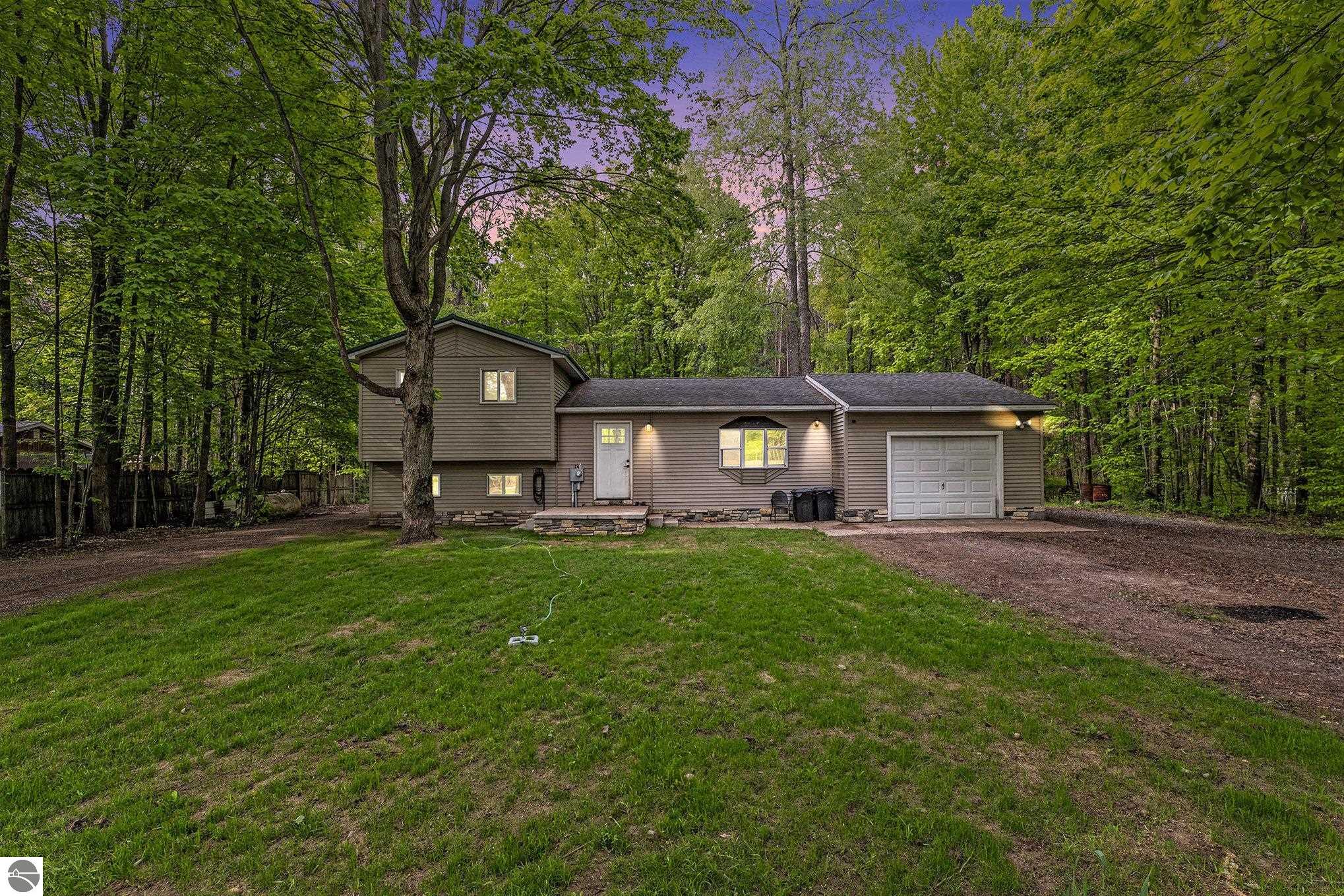 4891 Fell Drive, Marion, MI 49665 — front exterior