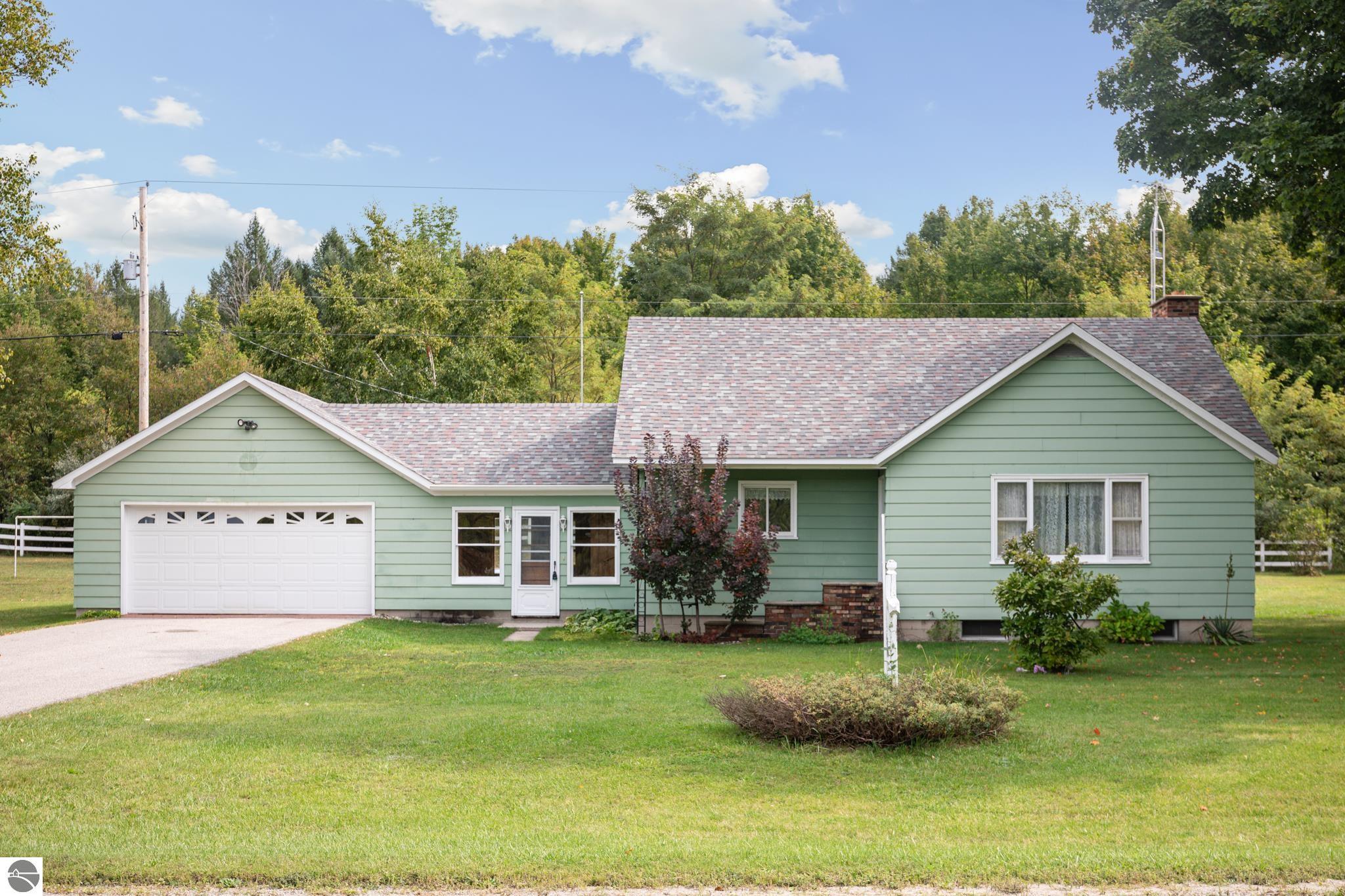 10981 S Tower Road, Maple City, MI 49664 — front exterior