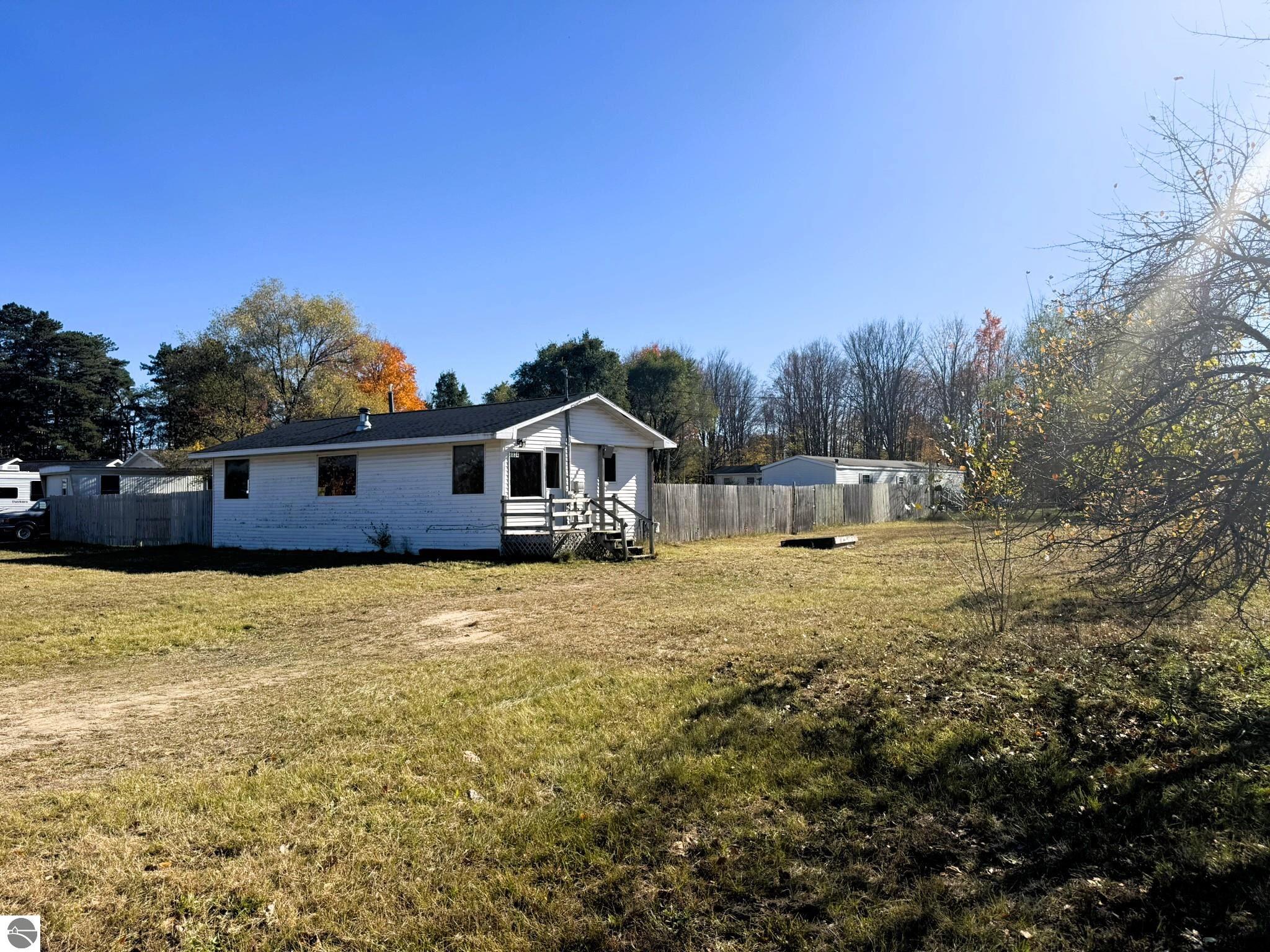 8034 Garfield Street, Rapid City, MI 49676 — front exterior