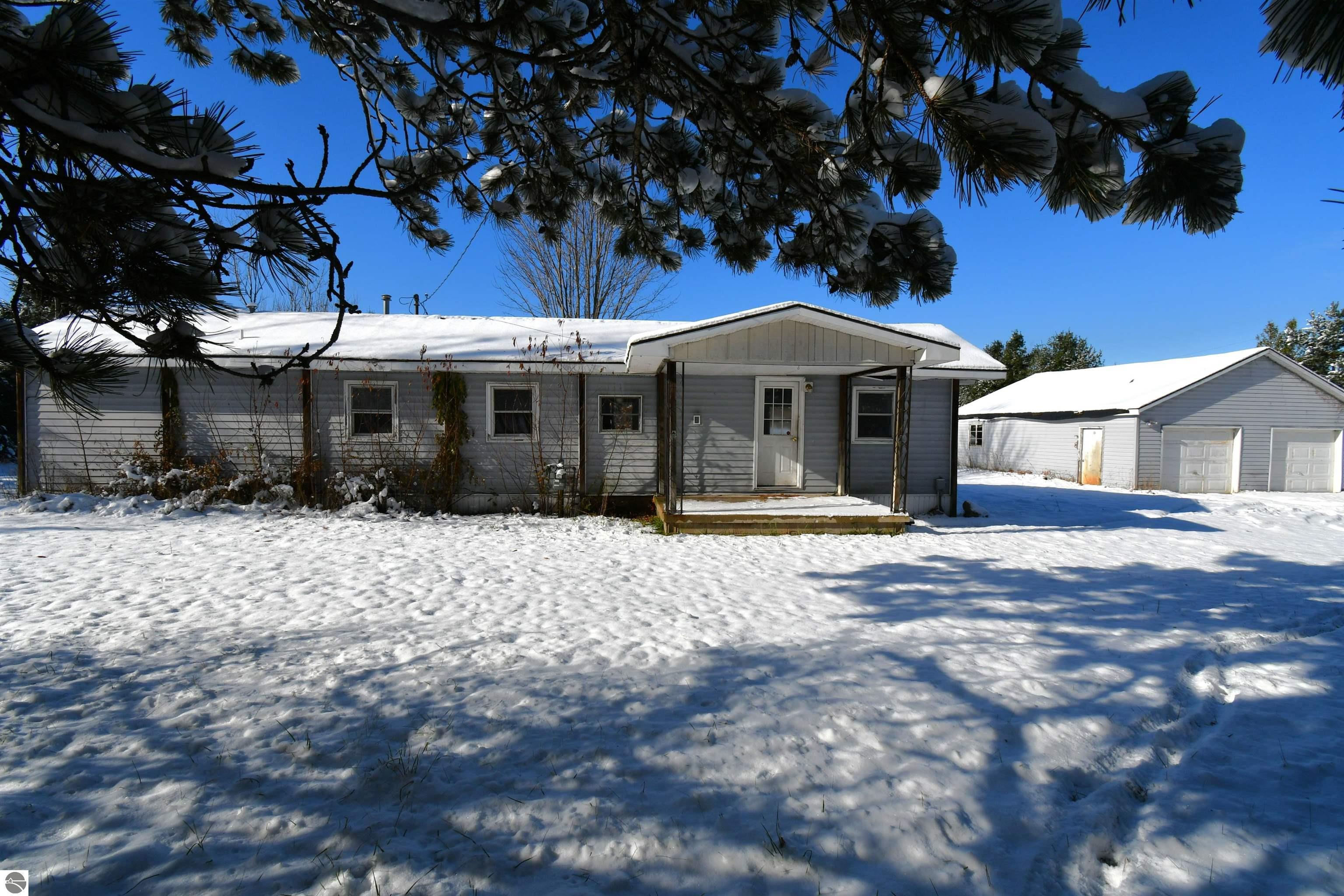 8324 Miller, Alanson, MI 49706 — front exterior