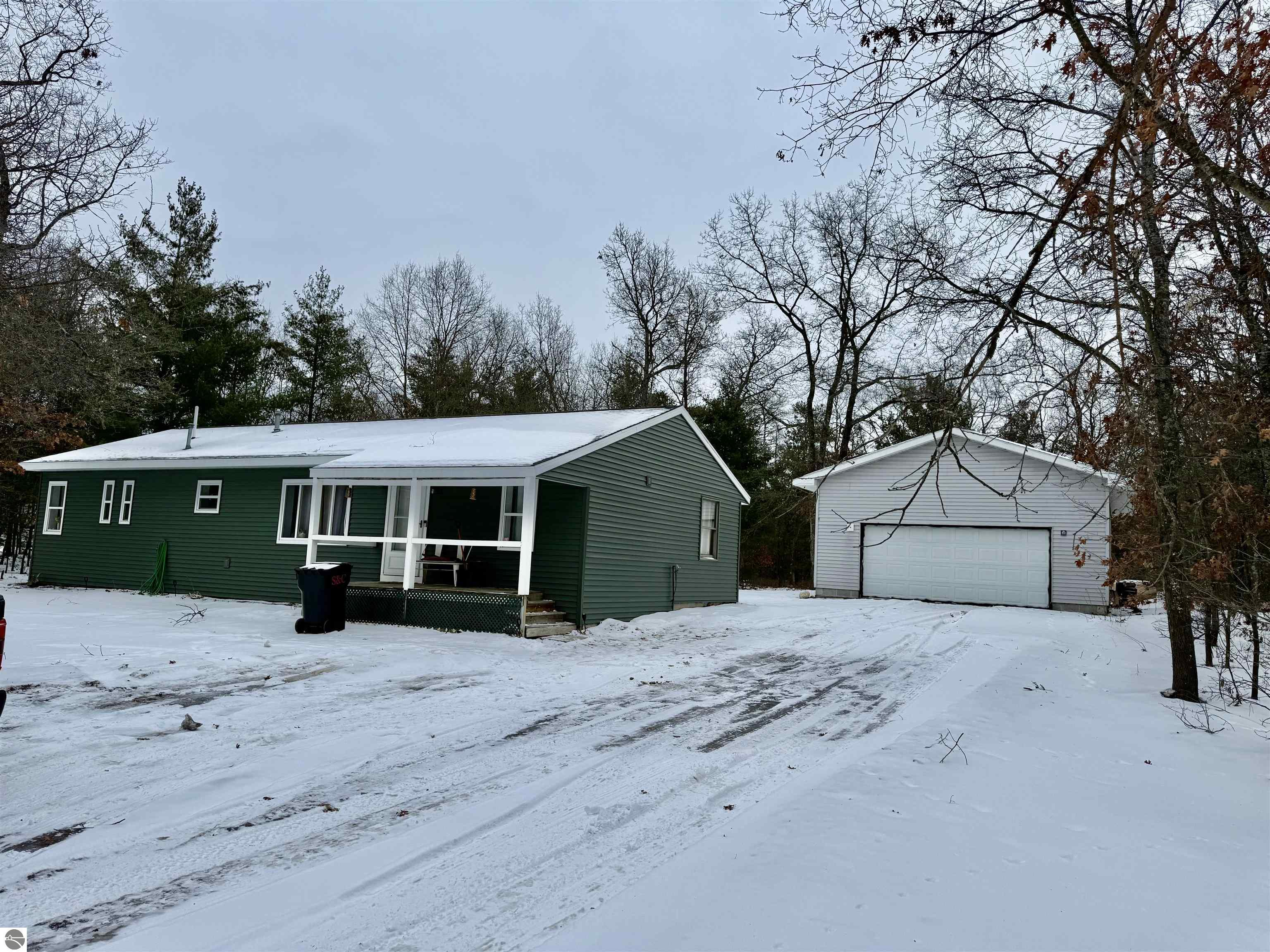 7036 Indian Trail, Oscoda, MI 48750 — front exterior