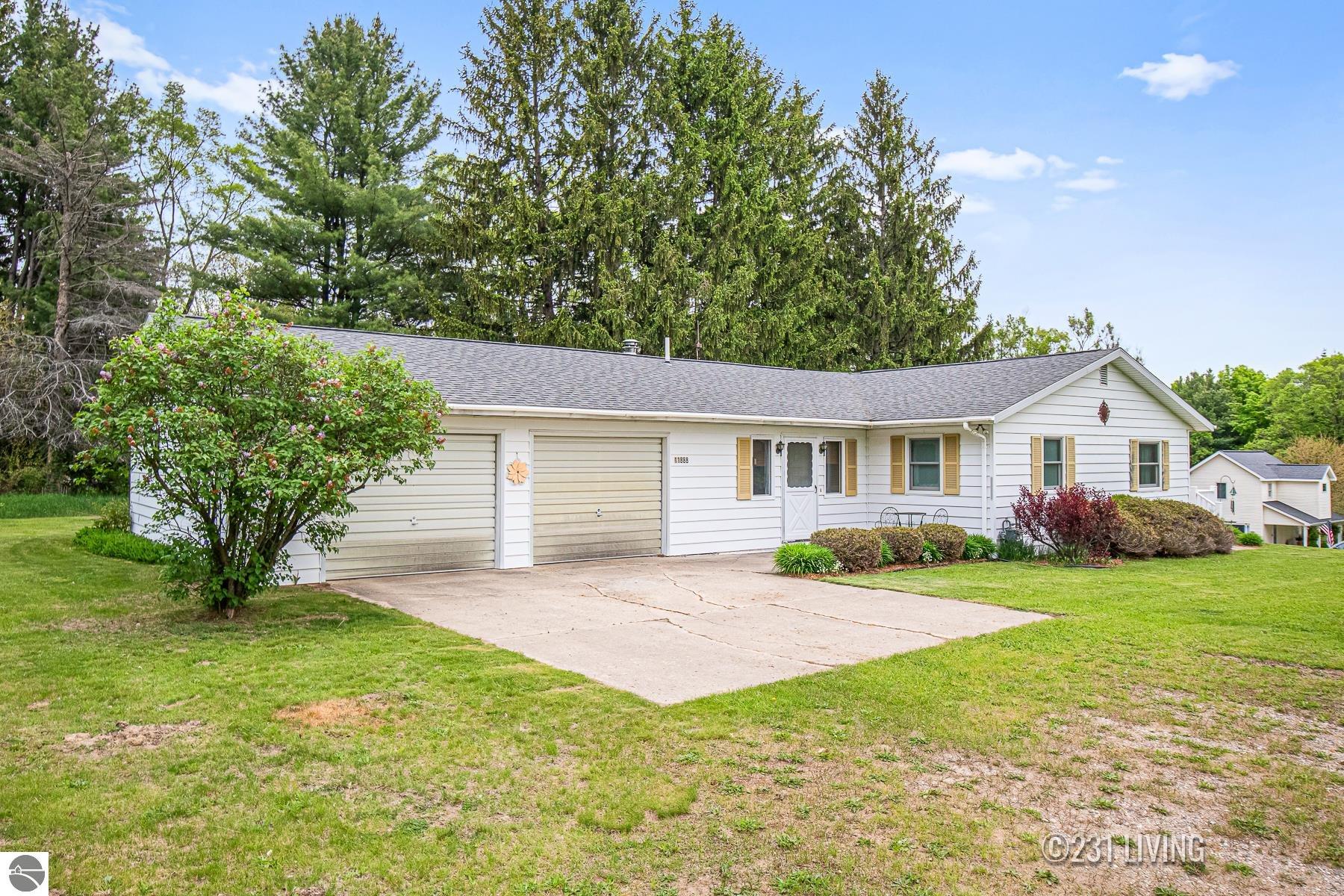 11888 Hickin Road, Rapid City, MI 49676 — front exterior