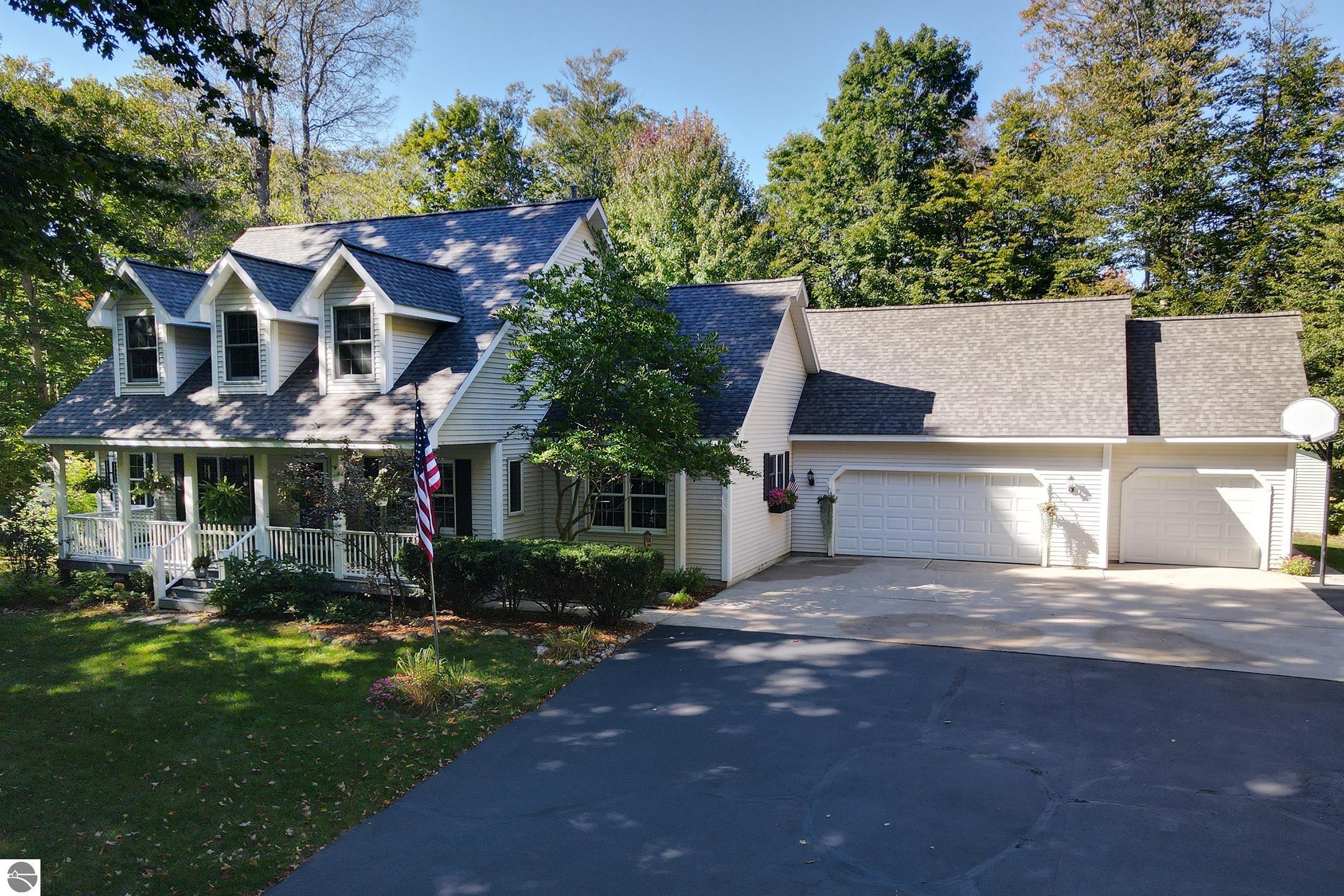 12900 S Woodhaven Lane, Traverse City, MI 49684 — front exterior