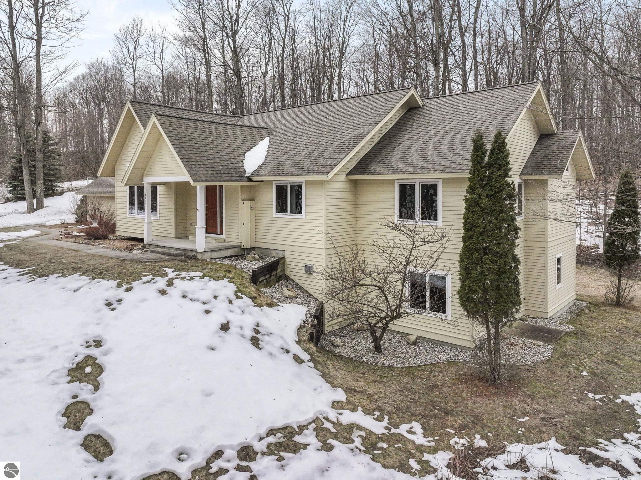 9871 E Woodcrest Court, Suttons Bay, MI 49682 — front exterior