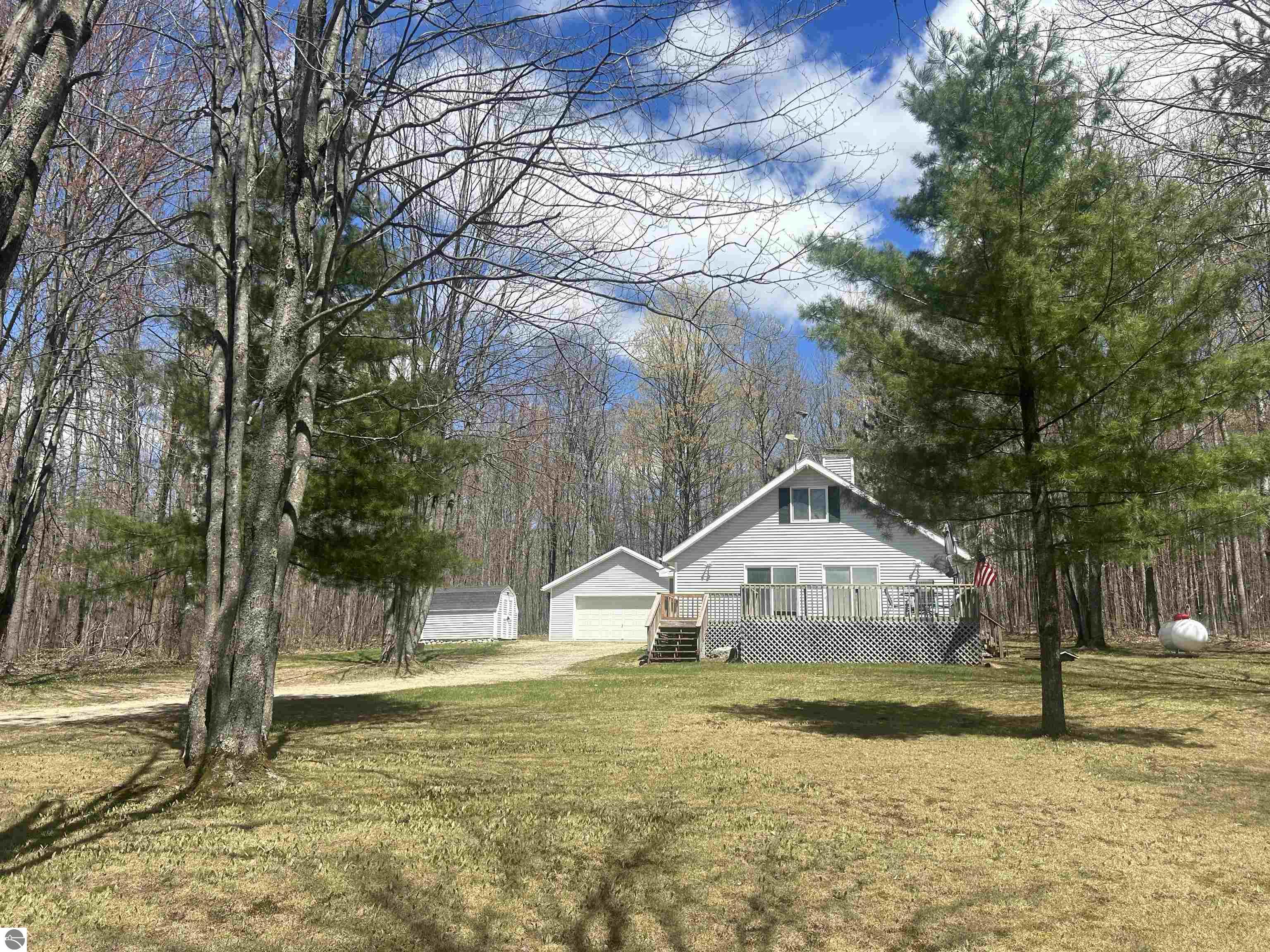 10743 Sprucedale Circle, Elmira, MI 49730 — front exterior