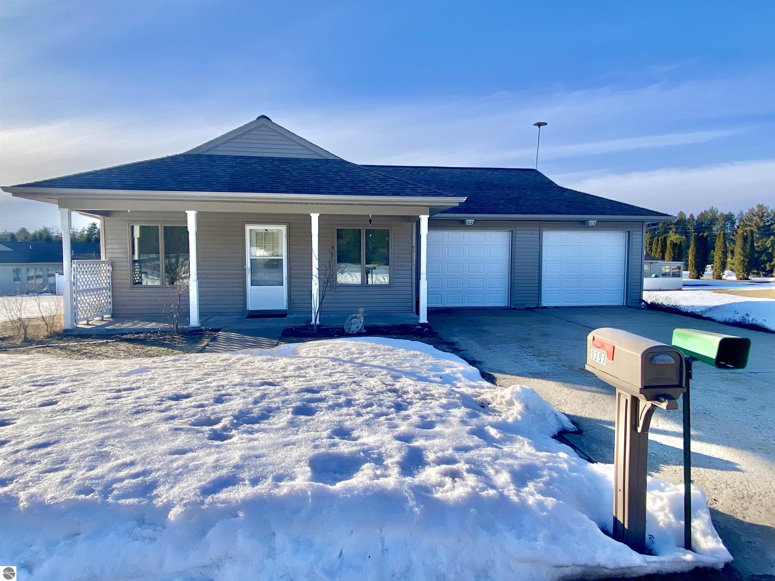 9391 NE Chippewa Drive, Mancelona, MI 49659 — front exterior