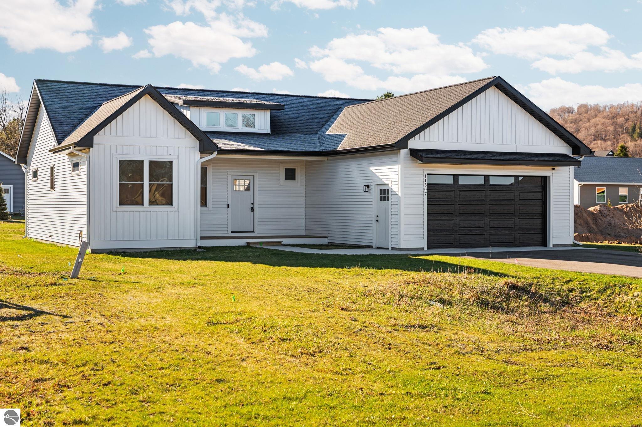 11507 S Sunset, Empire, MI 49630 — front exterior