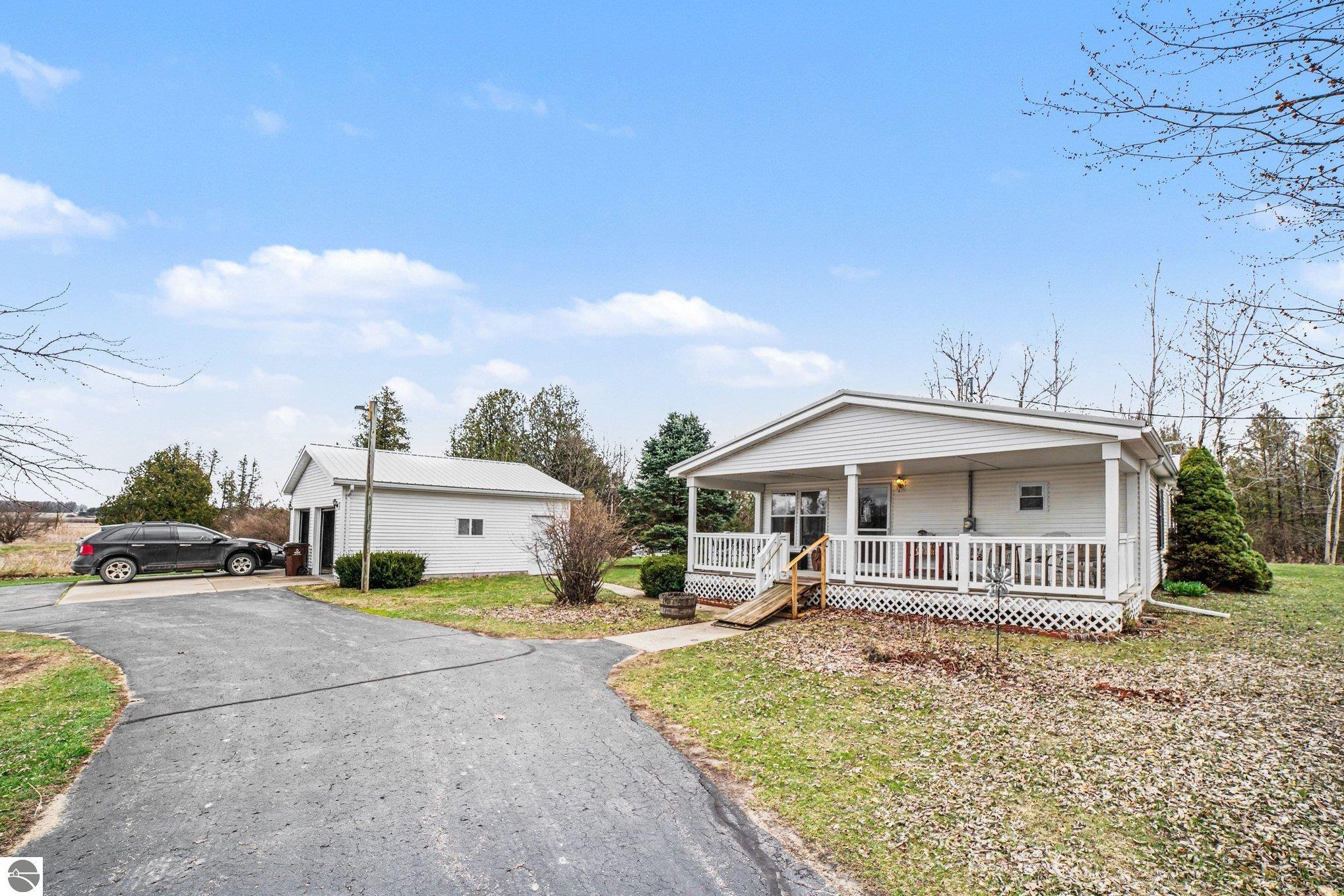 7915 S Curtis Road, MI 48858 — front exterior