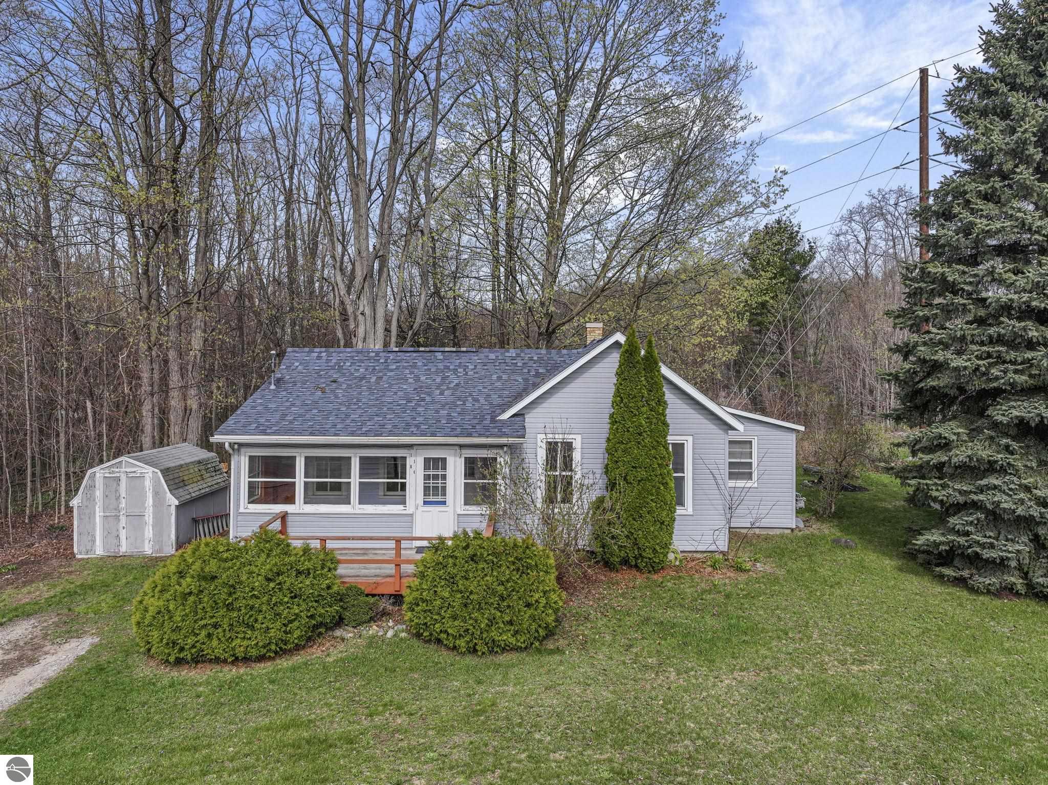 7186 Cairn Highway, Kewadin, MI 49648 — front exterior