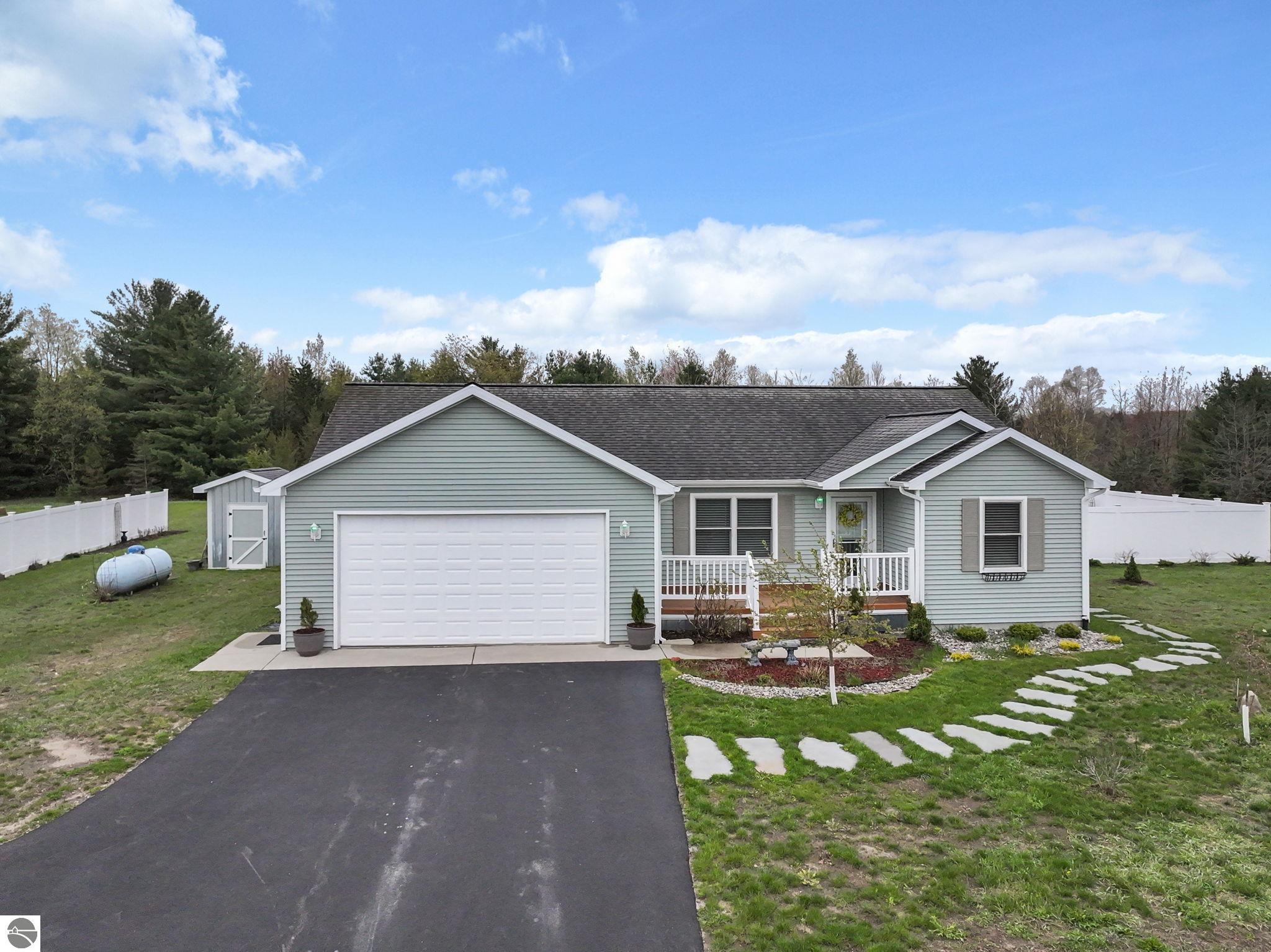 8576 King Arthurs Court, Kingsley, MI 49649 — front exterior