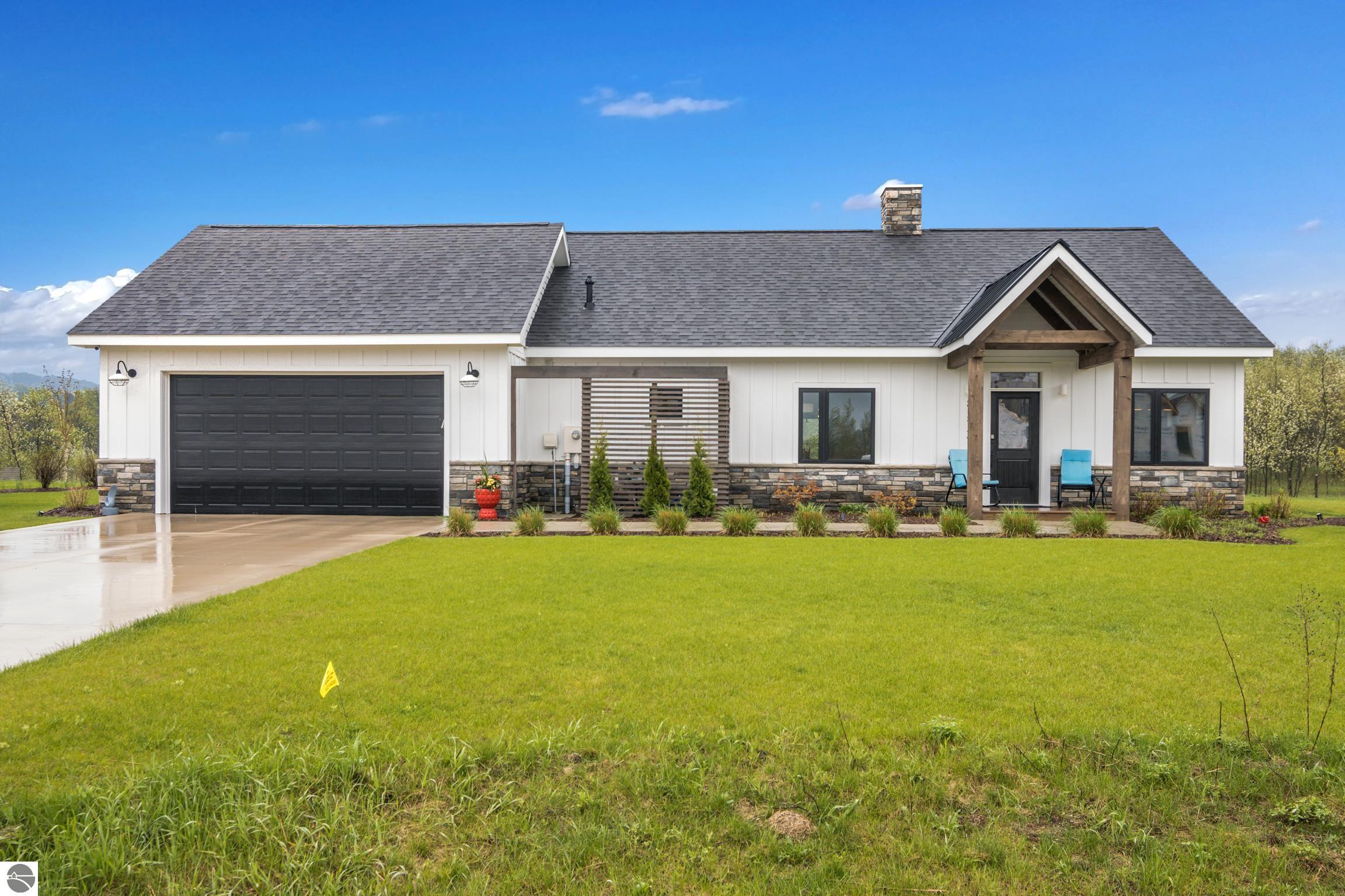 8573 S Olivia Drive, Maple City, MI 49664 — front exterior