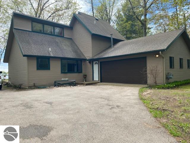 8779 Swan Point Road, Elk Rapids, MI 49629 — front exterior