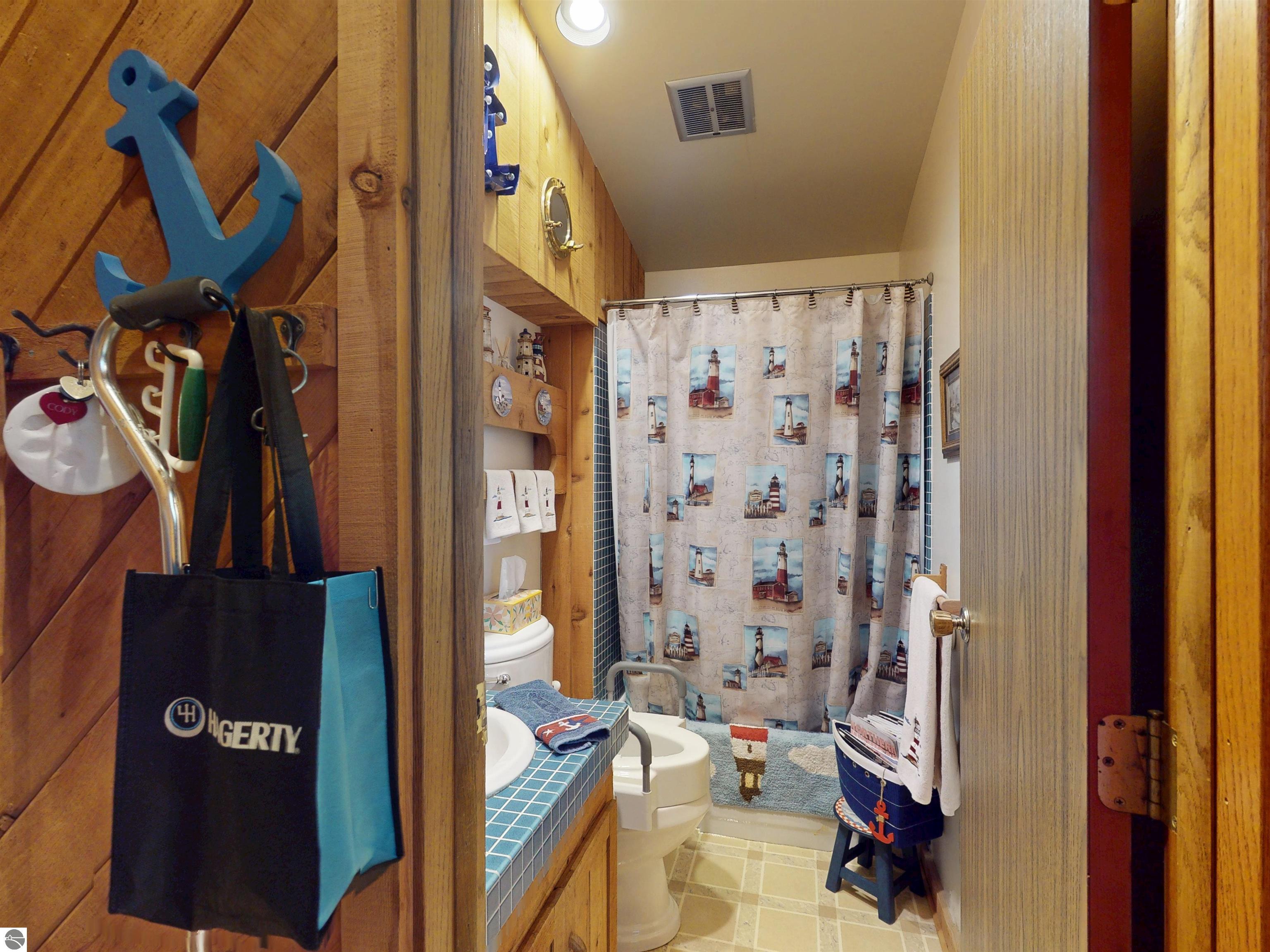 8645 Skegemog Point Road, Williamsburg, MI 49690 — Photo 59