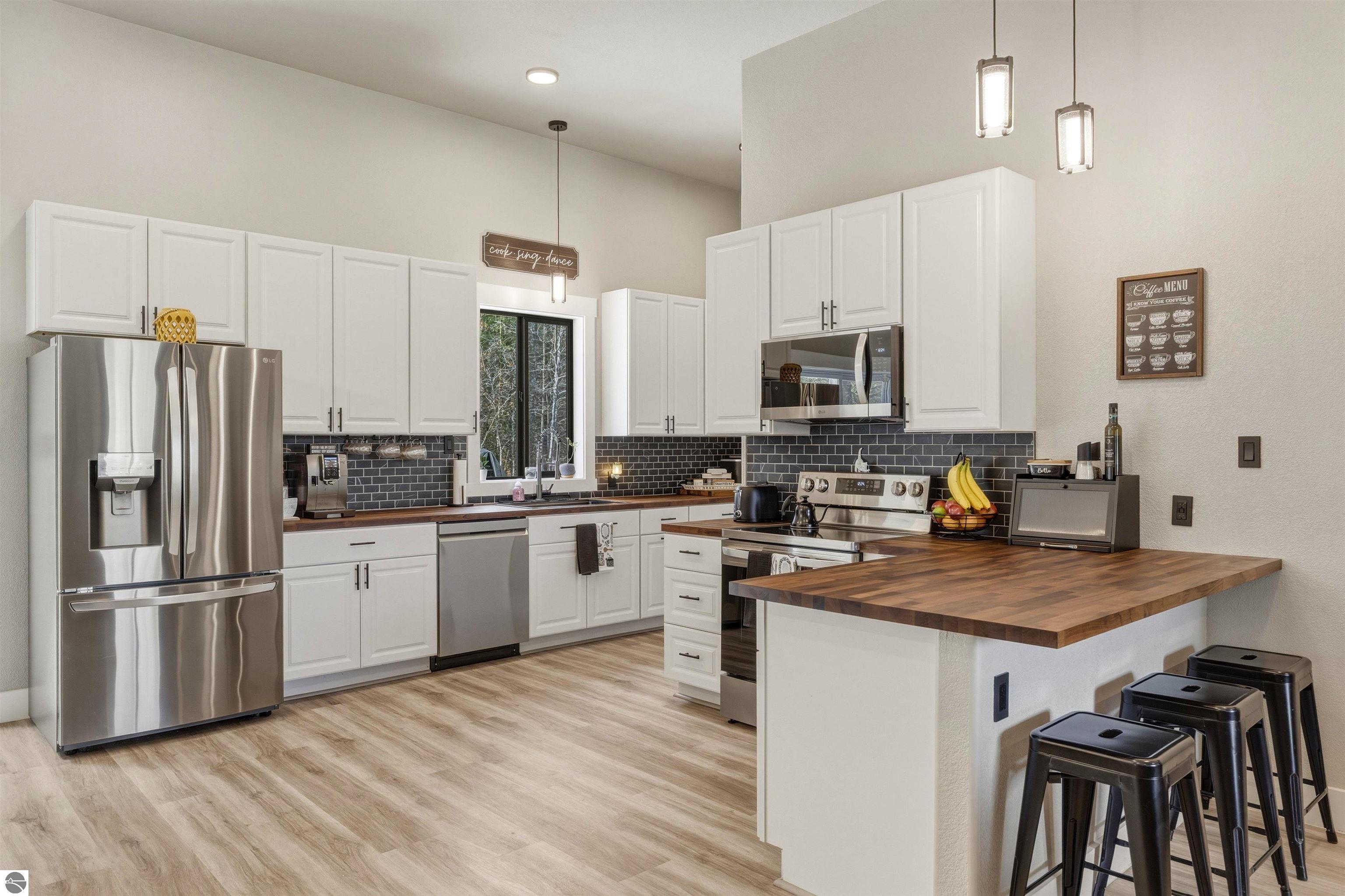 8006 Springwater Drive, Rapid City, MI 49676 — Photo 16