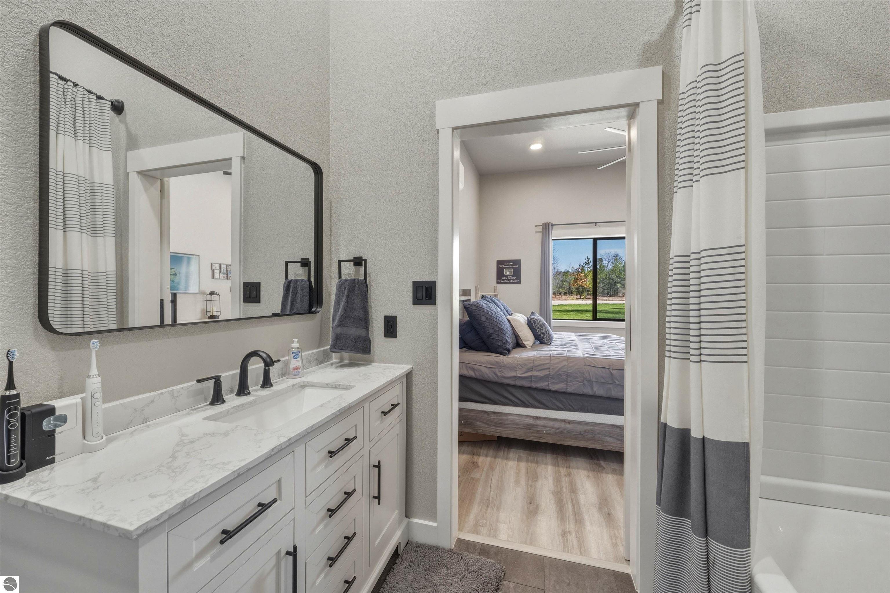 8006 Springwater Drive, Rapid City, MI 49676 — Photo 30