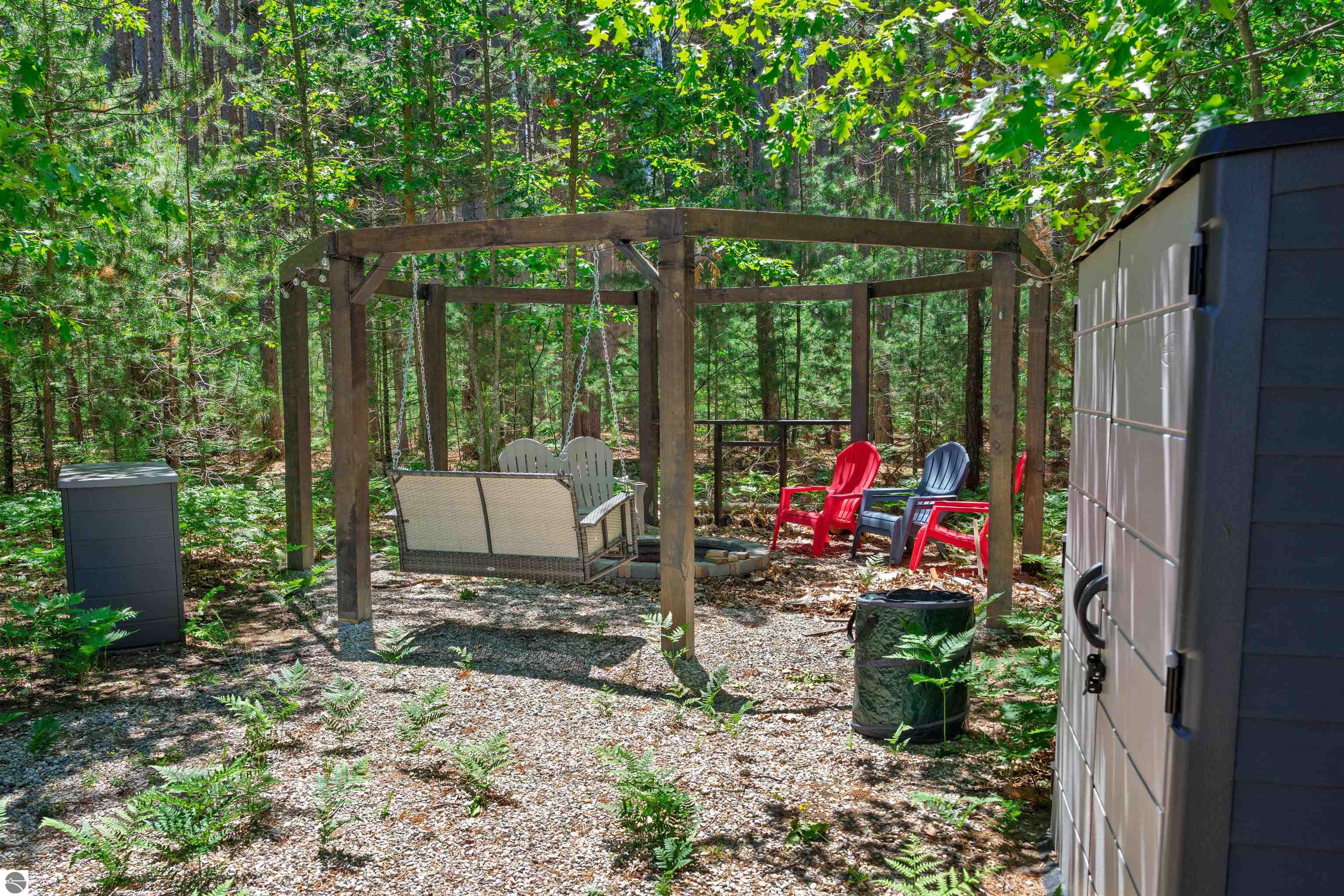 8006 Springwater Drive, Rapid City, MI 49676 — Photo 48