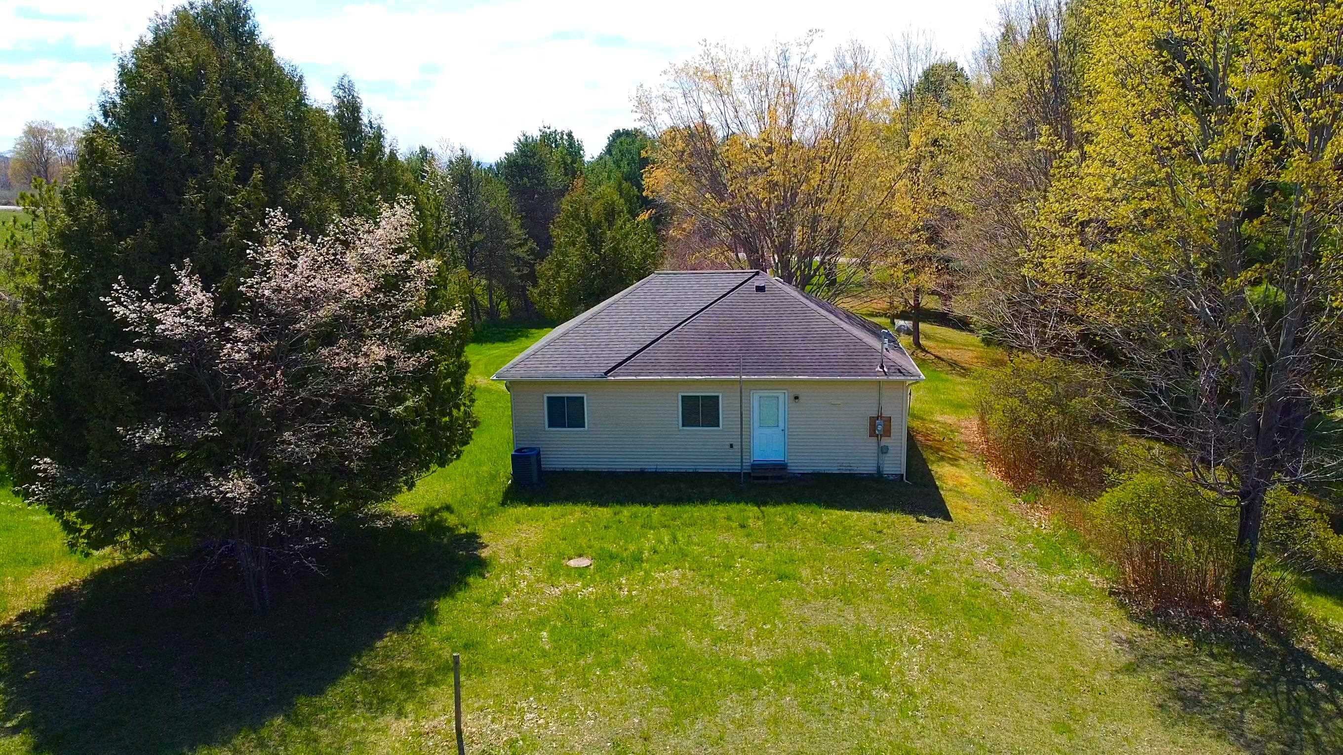 1st image of 12850 Miller Rd, Rapid City, MI 49676 | MLS# 80068044