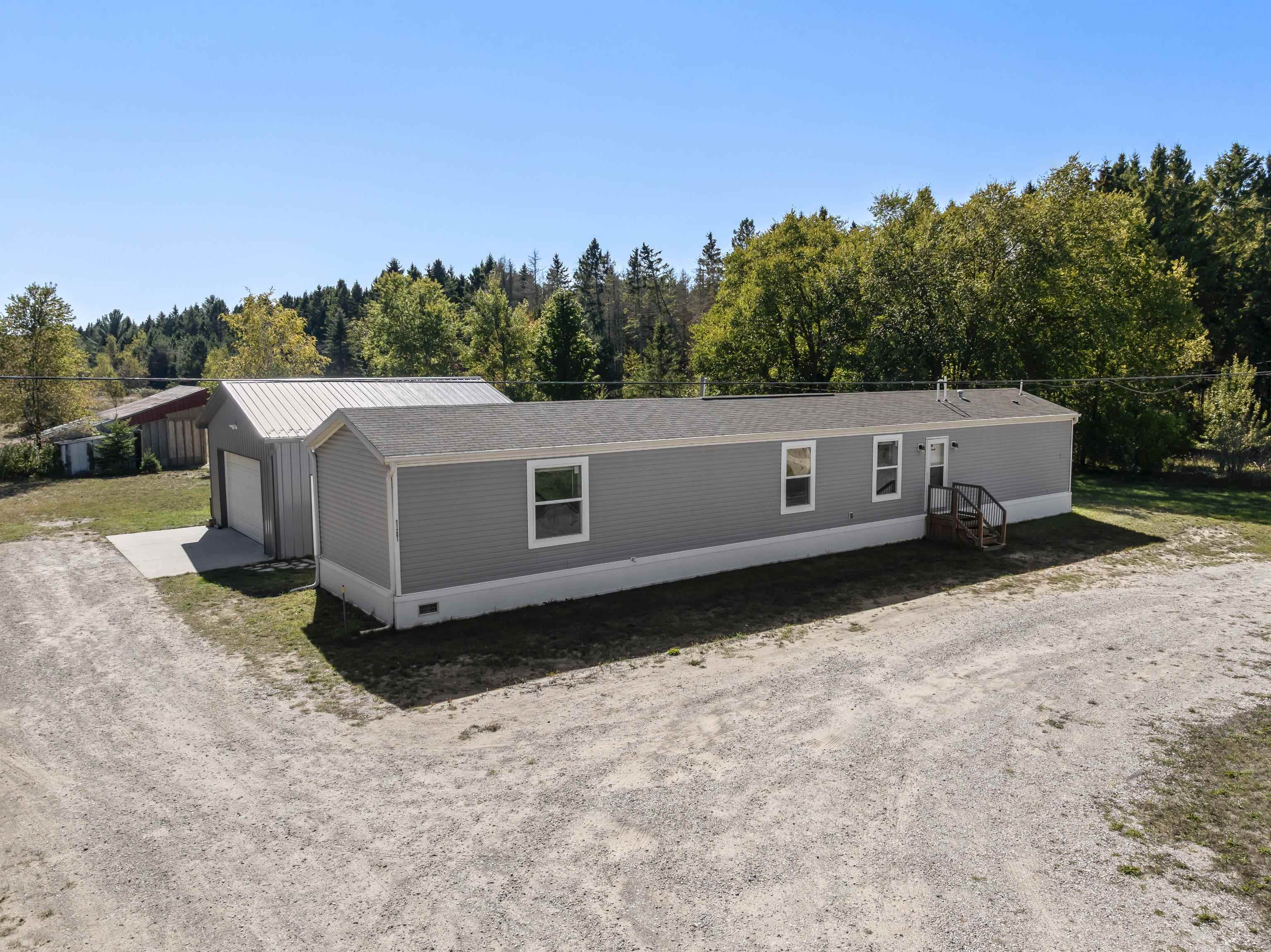 Photo 1 of Single family home for sale at 11261 Maple Rd, Beulah, MI 49617 | MLS# 78080073970 | Listing updated on 2026-10-06