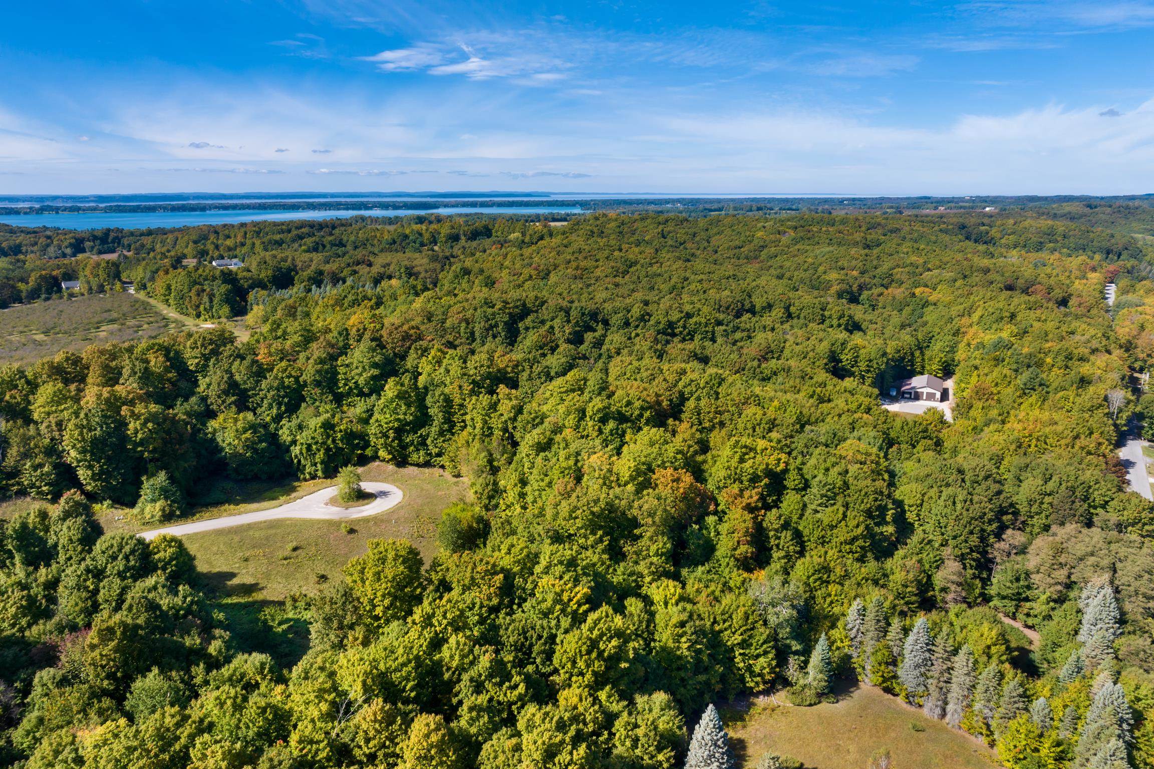 Photo 3 of Land for sale at Lot 8 Timber Valley Ct, Rapid City, MI 49676 | MLS# 78080074202 | Listing updated on 2026-10-06