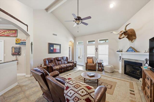 Living room with fireplace and vaulted ceiling