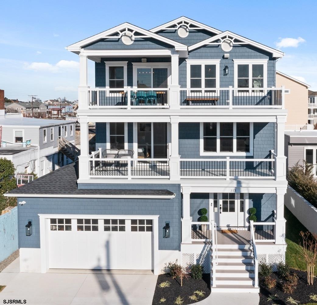 NEW CONSTRUCTION – COMING SOON! Just 1.5 blocks from the beach, this exceptional coastal home is being built by Woerner Custom Builders and is ideally located just steps from the sand and a short walk to restaurants and shopping. This stunning residence will offer 6 bedrooms and 4 custom baths, designed with sought-after reverse living to maximize comfort and coastal enjoyment. The open and expansive floor plan includes an elevator for added convenience. The lower level offers a full bath, a bonus room, and a spacious garage. The second level features a luxurious primary suite with a spa-inspired bath, large shower, and access to a private deck, along with a generous junior primary suite that includes its own private bath. The top level is designed for entertaining and coastal living, showcasing an oversized front deck spanning the entire width of the home. This space also offers a gourmet granite kitchen with stainless steel appliances, hardwood flooring throughout, a dining area, and a living room with a gas fireplace. An additional bedroom and full bath complete this level. This home perfectly blends luxury, comfort, and coastal living, offering easy access to sun, sand, and surf—ideal for both vacationers and year-round residents. All within walking distance to shopping centers and popular local restaurants. Please note: Photos shown are of a similar property. The home currently under construction will be very similar in style, layout, and finishes.