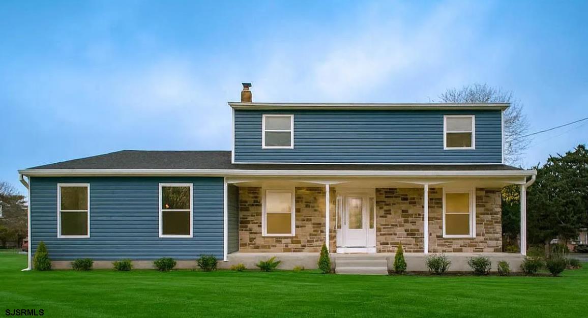 Stunning, fully renovated Colonial home in desirable Marmora, Upper Township! This beautifully reimagined 3-bedroom, 2.5-bath single-family home offers modern finishes, quality craftsmanship, and a thoughtfully updated floor plan—truly a turnkey opportunity in one of Cape May County's most convenient locations. The exterior has undergone a complete transformation, featuring a brand-new roof, siding, windows, soffits, fascia, and all-new front, rear, and deck doors. A brand-new composite deck offering the perfect setting for outdoor dining, entertaining, or simply enjoying the peaceful neighborhood surroundings. Inside, you're welcomed by a bright marble-tiled foyer that flows directly into the completely redesigned kitchen. The interior boasts new luxury vinyl plank flooring, fresh paint, and all-new recessed lighting for a warm and cohesive atmosphere throughout. The redesigned kitchen is equipped with two-tone slim shaker cabinetry, quartz countertops, a full-height quartz backsplash, stainless steel appliances, and a breakfast bar, making it both functional and visually striking. The inviting living room features vaulted ceilings, adding volume and natural light, along with a wood-burning fireplace that creates the perfect cozy focal point. Dual glass doors open to the deck, seamlessly connecting indoor and outdoor living spaces. Upstairs, the spacious primary suite offers a private retreat complete with a walk-in closet and an updated full bathroom. Two generously sized guest bedrooms share an upgraded hall bath with a tub/shower combo, ideal for family or guests. A convenient first-floor powder room, updated fixtures, and modern finishes complete this exceptional interior. Additional highlights include a brand new electrical panel, new hot water heater, new washer and dryer, new garage door, refreshed landscaping, and a layout perfectly suited for year-round living or a shore retreat. Located just minutes from the Garden State Parkway, Ocean City beaches, Beesleys Point, Cape May, local marinas, restaurants, and the amenities of both Ocean City and Atlantic City, this home offers the best of coastal living with easy access to everything the shore has to offer. This is a rare opportunity to own a thoughtfully renovated home in a prime Upper Township location - don't miss it!