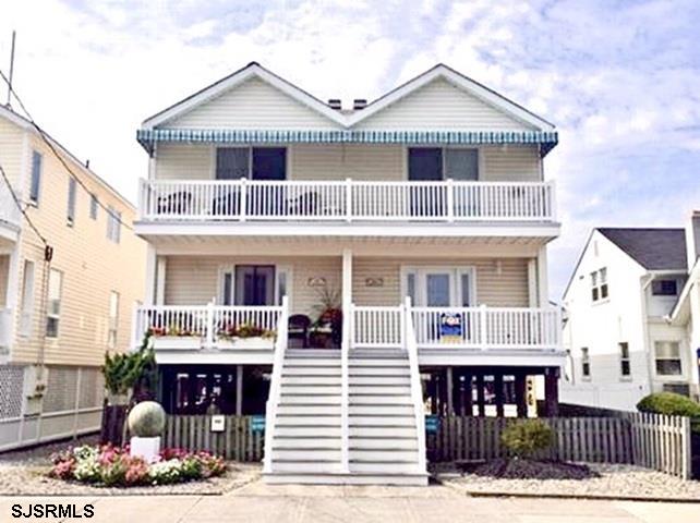 Located just steps from the beach and boardwalk, this exceptional coastal property offers ocean views and an unbeatable shore lifestyle. The home features five bedrooms and plenty of room for entertaining, with thoughtfully designed living areas that flow seamlessly to both front and rear decks, perfect for enjoying ocean breezes and hosting gatherings. Additional highlights include off-street parking for multiple cars and an enclosed outdoor shower for easy post-beach living. With a strong history of performing well as a summer rental, this property presents an excellent opportunity for both personal enjoyment and investment in a prime beach block location.