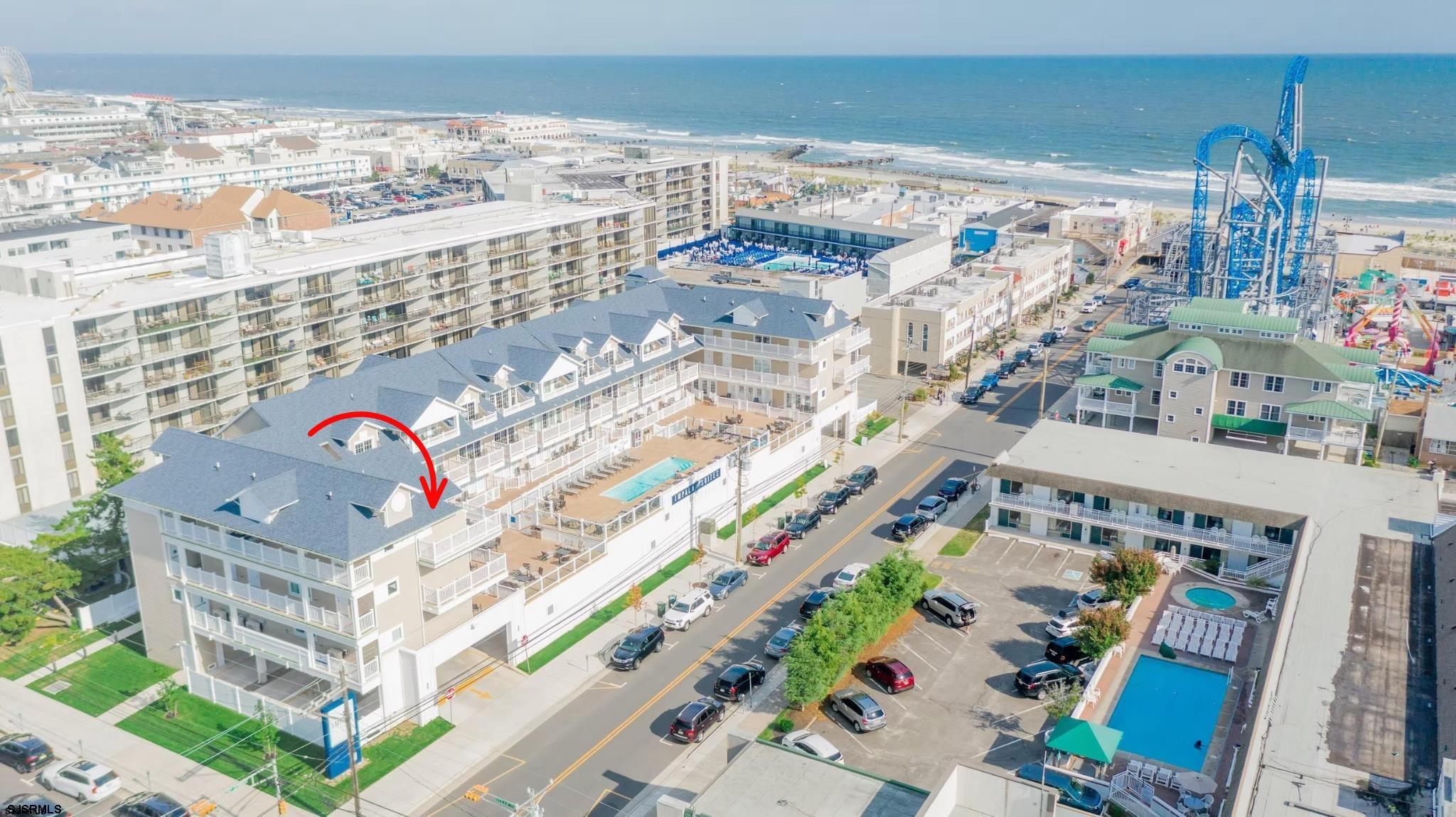 Proven six-figure rental income in a prime beach block location! This fully furnished 3 bedroom, 3 bath luxury condo at Impala Suites features ocean views, a flexible layout, and generated $115,000 in rental income last year.  Located on the top floor and totaling 1,417 sqft, this end unit can be enjoyed as a full 3 bedroom, 3 bath residence with a living room and kitchen, or divided into two or three separate units to maximize rental potential.   The middle unit spans over 600 sqft and includes a kitchen, living area, private deck, and a bedroom with a king size bed and ensuite bath. The two smaller units each offer nearly 400 sqft, with spacious bedrooms furnished with two queen beds, ensuite baths, and private decks. Each unit has a separate entrance, ensuring privacy for every guest. This configuration allows owners to accommodate large families, host multiple reservations, or enjoy personal use in one unit while renting out the others - a rare setup in Ocean City that provides both enjoyment and income.  Two assigned parking spaces, elevator access, a resort-style pool, and immediate access to the beach and boardwalk add convenience and keep rental demand strong.  On-site professional management handles bookings and guest services, providing a streamlined and effortless ownership experience.  Strong income, luxury accommodations, and an unbeatable location make this a standout opportunity in Ocean City!