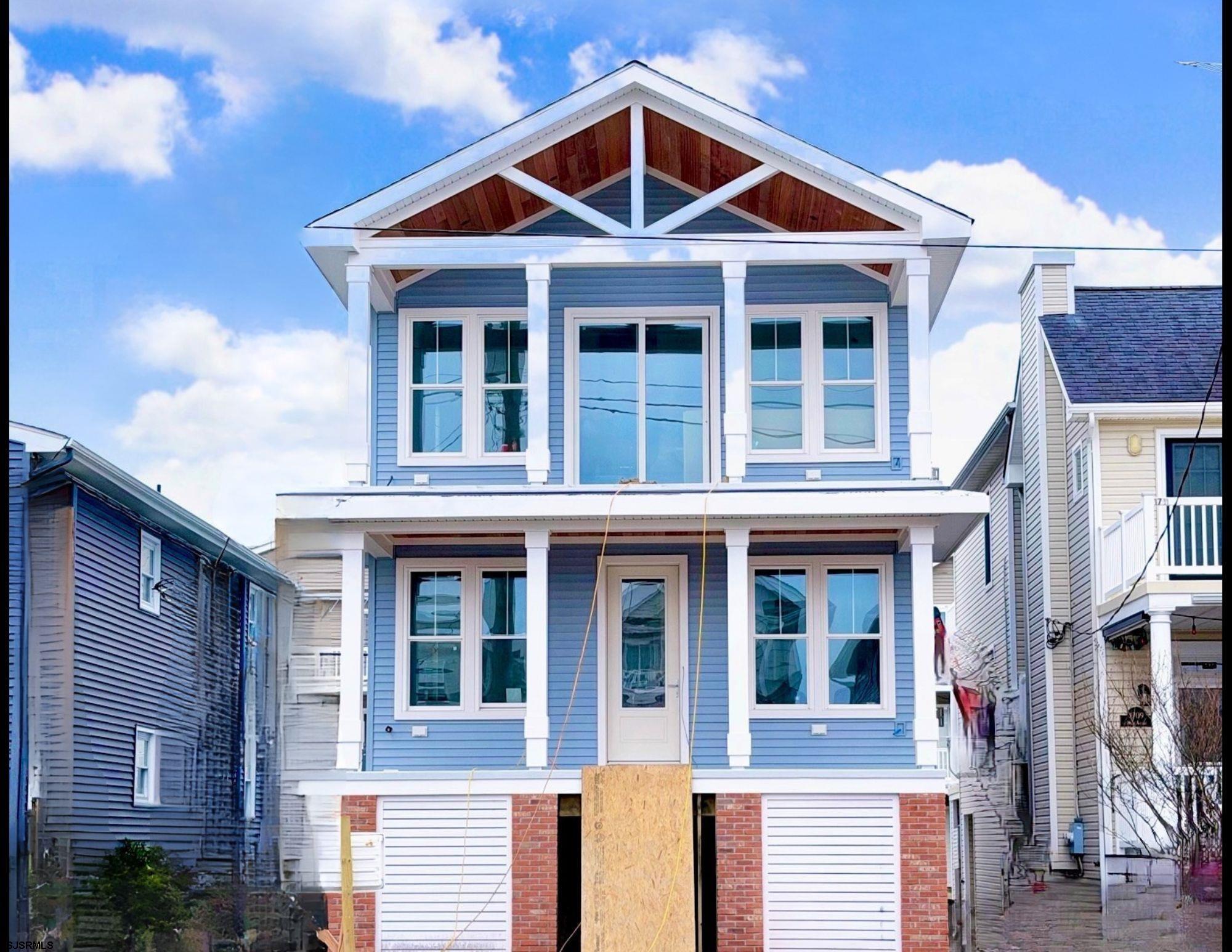 Another Stunning New Construction Home Brought to you by Clark Edward Development! This stunning new construction 3-bedroom, 2-bathroom first-floor condo is perfectly situated just steps from the beach and vibrant downtown shops. Access through your private entrance and step into a bright and inviting great room featuring a cozy gas fireplace, seamlessly connected to a beautiful kitchen that’s a culinary delight. With a center island, custom cabinetry, granite countertops, and a stylish tile backsplash, it’s ideal for both casual meals and entertaining guests. Embrace the coastal lifestyle on the expansive front porch, perfect for dining al fresco or relaxing after soaking up the sun. Your primary suite serves as a luxurious escape, complete with a custom-tiled bathroom and an oversized closet to meet all your storage needs. A full-size laundry closet enhances daily convenience. Outdoors, enjoy rear alley access to the attached garage along with an additional off-street parking space. Rinse off in the enclosed outdoor shower after beach adventures and take advantage of the extra storage available. This condo masterfully combines modern amenities with beachside charm, delivering the ultimate seaside living experience!