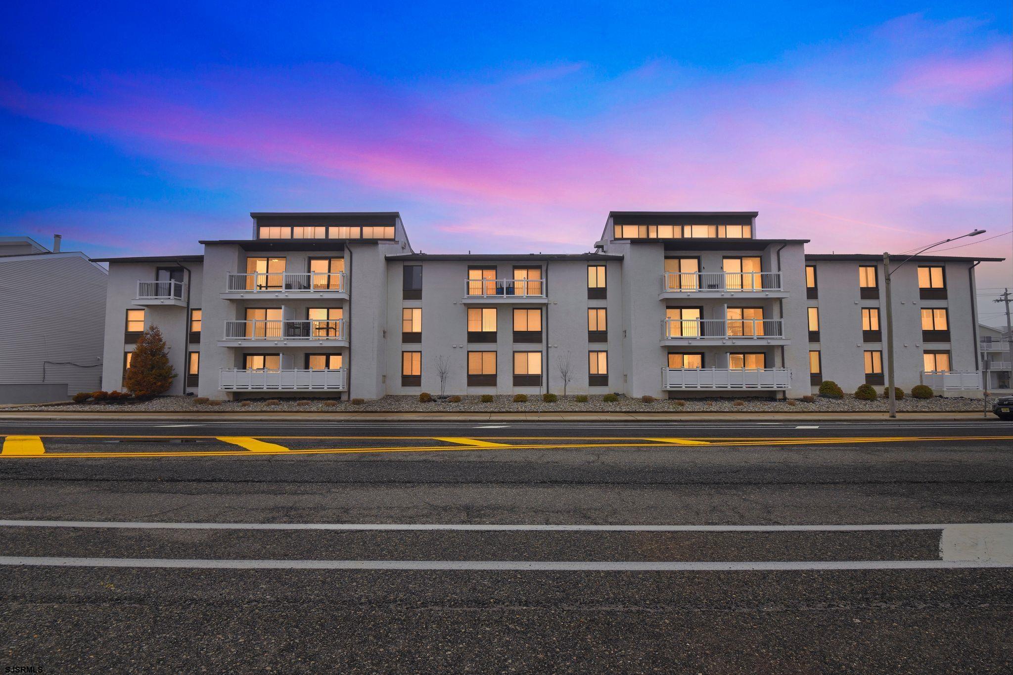 Rare opportunity to own a spacious top-floor penthouse at Seascape Condominiums in Ocean City’s desirable South End. This impressive 1,894 sq. ft. two-level residence offers the perfect blend of coastal views, modern updates, and exceptional living space.  The fully updated kitchen features stainless steel appliances, granite countertops, tile backsplash, and ample cabinetry, flowing seamlessly into the main living and dining areas. The home is enhanced by luxury vinyl plank flooring throughout, a brand new code-compliant staircase leading to the second level featuring two bedrooms and full bathroom, and numerous storage options including multiple closets and a walk-in closet in the first floor primary suite. A custom bar area that sits adjacent to the dining area with mini-fridge adds an ideal touch for entertaining.  The first level showcases a large deck overlooking the Intracoastal Waterway and vibrant marshlands, offering beautiful sunset views and coastal breezes. Upstairs, the expansive second-level deck is a hidden gem, providing generous lounge space and additional ocean views.  This residence also features 2.5 updated bathrooms including a renovated primary bath, making the home as functional as it is stylish.  Seascape Condominiums is a well-managed, financially strong association with excellent reserves and very low turnover. Amenities include elevator access, secured entry, newer decks and railings, outdoor shower, assigned parking, and more. The condo fee covers insurances, water/sewer, exterior maintenance and utilities, trash removal, and contributions to capital reserves, providing owners with convenient, worry-free ownership.  The corner location at 41st Street offers the best of Ocean City living—just steps to the beach, quick access over the 34th Street bridge, and an easy bike ride to the 34th Street recreational area with playgrounds, tennis courts, restaurants, and shopping.  A rare South End penthouse with exceptional space, views, and updates—this is coastal living at its finest.