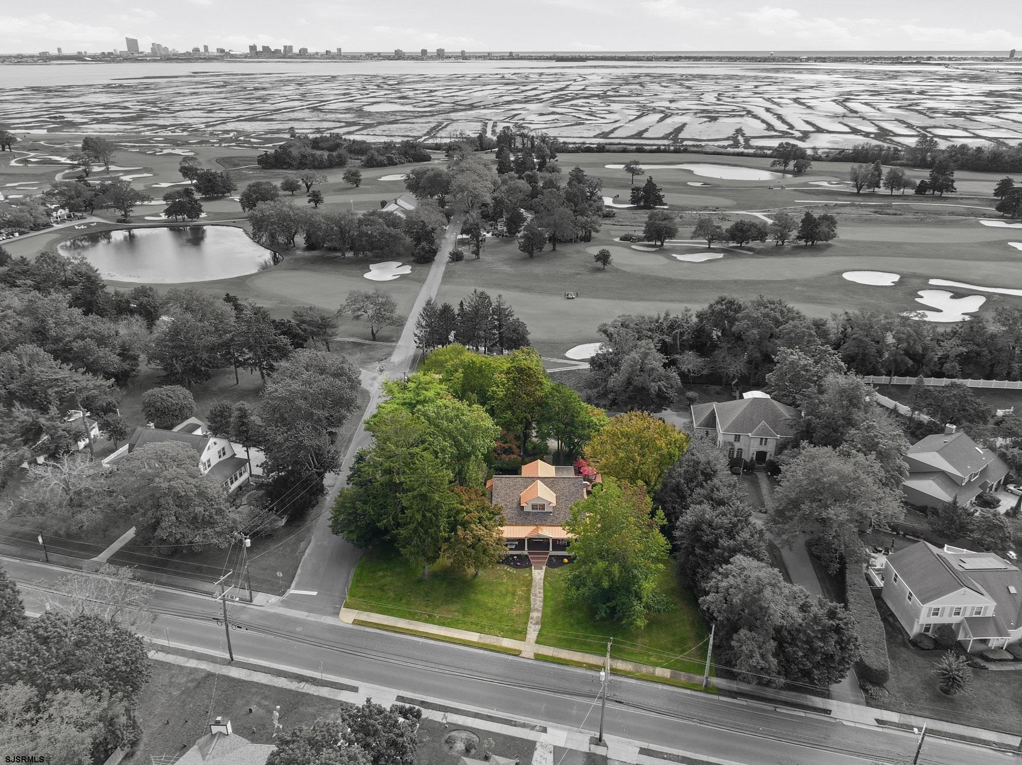 Some homes are simply built differently. 1202 Shore Road is one of them. Set privately along the prestigious Atlantic City Country Club, this magnificent 1903 estate offers something genuinely rare in South Jersey — a resort lifestyle, historic grandeur, and effortless luxury, all in one address. Sunrise views greet you each morning. A newly renovated wraparound front porch invites you to slow down and stay. Step inside and the craftsmanship speaks immediately — ornate ceilings, graceful arches, and historic millwork that simply cannot be replicated, paired seamlessly with GE Café appliances, granite countertops, and a designer backsplash that would satisfy any discerning chef. This is not a house. This is a retreat. Five generous bedrooms. Three beautifully appointed baths. 3,114 square feet of refined living space designed for those who entertain with elegance and live without compromise. Two rear decks extend the living space outdoors into a private sanctuary — lush gardens, a tranquil koi pond, and mature grounds that feel worlds away from everything while remaining minutes from the shore. The floor plan flows with ease and intention — from intimate evenings to gracious entertaining, every space feels considered and complete. For the buyer who has arrived. For the professional ready for something extraordinary. For the couple whose next chapter deserves a home worthy of everything they have built. This is that home.