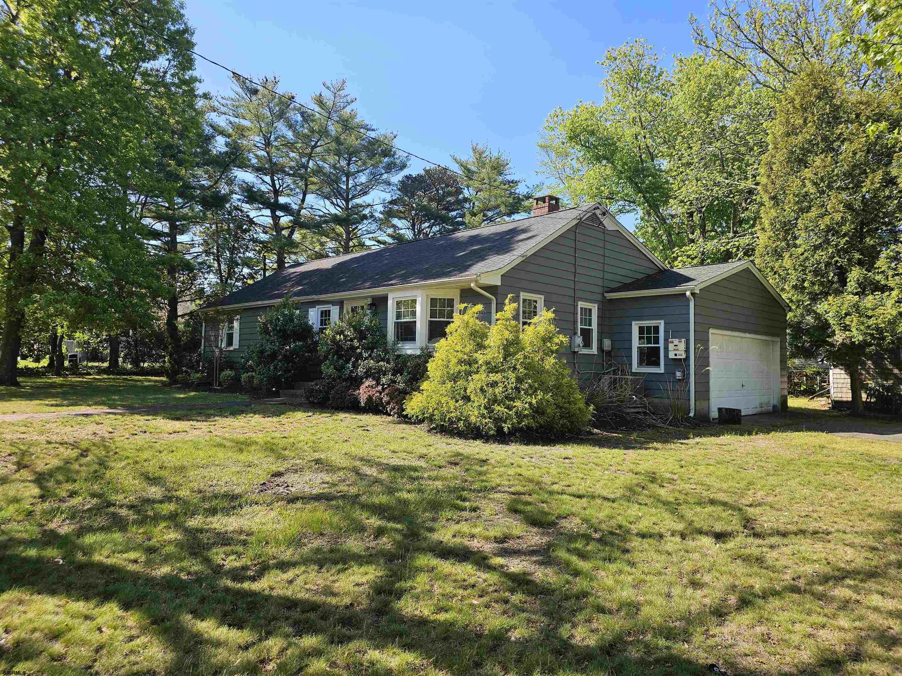 Highly sought after section of Beesleys Point. Wonderful mixture of old world coastal cottage details and modern amenities. Perfect for year round living on quite street with few houses or seashore getaway with room to park your boat off season. Spacious garage & utility shed. Lower taxes and no condo fees! Great spot to retire or enjoy your summer getaway minutes from Ocean City, Strathmere and close to Sea Isle City too. Walk or ride your bike to Tuckahoe Inn, Upper beach, Public boating ramps and new project in planning for Beesleys Point development. Spacious living area greats you with custom shelving built-ins surrounding beautiful fireplace, wood plank tile flooring, bay window and flows to dining area adjacent to rear screened in porch, with newer kitchen across & view of private back yard with deck. Peaceful living with larger corner lot offering more privacy than most and room for more. Easy functional floor plan all on one level with master bedroom en-suite added in 2016. Many major improvements including new windows, flooring, kitchen & bath all redone. Nothing to do but enjoy!