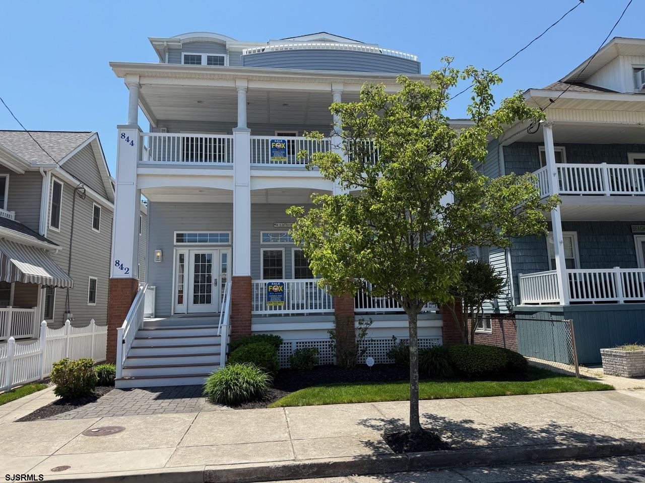 Welcome to your DREAM Beach house in the heart of Ocean City! This stunning 1st floor offers 4 bedrooms, 2.5 Beautifully appointed baths, and an open concept design filled with SOARING HIGH CEILINGS and abundant natural light. Perfectly situated on the BEACH block just steps to the Beach and Boardwalk, this exceptional home combines luxury & coastal living with an unbeatable location. Enjoy relaxing mornings and breezy summer evenings on the huge front porch, ideal for entertaining family and friends! Additional highlights include a garage, convenient outdoor shower, beautiful flooring & immaculately maintained. Whether you are looking for the perfect vacation retreat, investment property, or year round residence, this desirable property offers the Best of Shore Living. 2nd Floor is also available for sale!