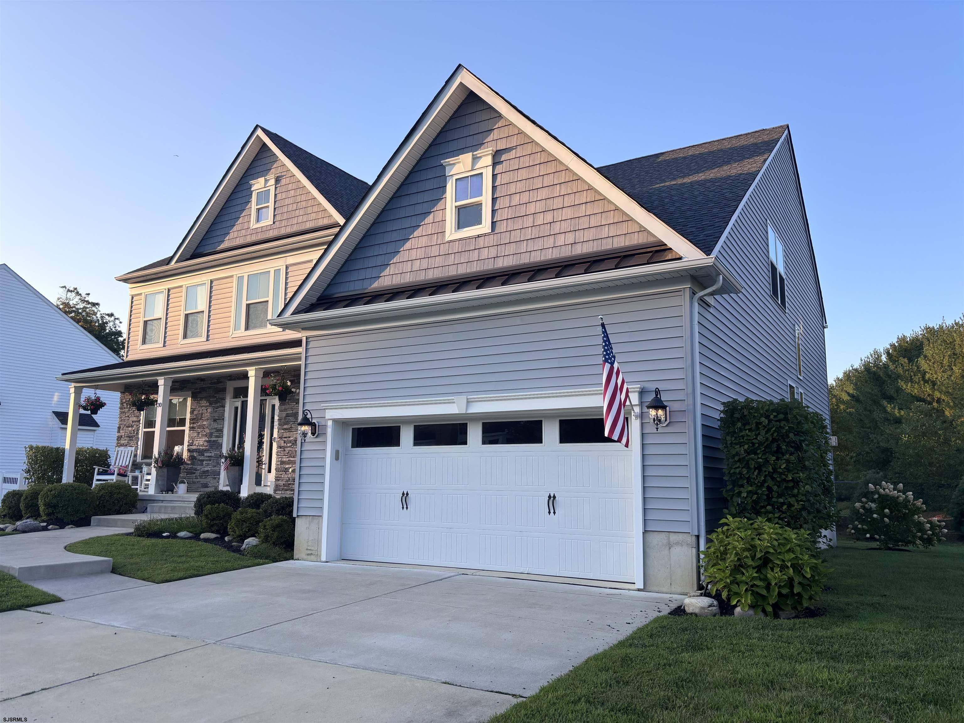 Welcome to 30 Monet Drive, this 4 bedroom 2-1/2 bathroom residence is one of only four farmhouse-style homes in the desirable Glen Eyre at Mays Landing community. Built with quality and loaded with upgrades, this home offers the perfect combination of space, style, and functionality. From the moment you walk in, you'll appreciate the 9-foot ceilings, beautiful hardwood flooring throughout the first and second floors, and a thoughtfully designed layout that's perfect for both everyday living and entertaining. The upgraded kitchen is the centerpiece of the home, featuring quartz countertops, an oversized center island, 42-inch custom cabinetry, stainless steel appliances, an extended kitchen layout, and a butler's pantry that provides additional storage and prep space. The kitchen flows seamlessly into the spacious great room, complete with a fireplace and a secondary staircase leading to the second floor. Upstairs, the primary suite offers a private retreat with a tray ceiling, large walk-in closet, and a beautifully finished ensuite bath featuring granite-topped vanities, a walk-in glass shower, and quality finishes throughout. The hall bathroom also features granite countertops, while dual furnaces, a water softener, and countless builder upgrades add comfort and efficiency throughout the home. The full 8-foot-high basement provides endless possibilities for additional living space, storage, or a future recreation area. Located just steps from the brand-new Mays Landing Golf Club, Mays XII and LaScala's Fire, you'll enjoy the convenience of golf, dining, and entertainment right around the corner. If you've been searching for a move-in-ready home with premium upgrades in one of Mays Landing's most desirable communities, this is one you won't want to miss. Schedule your private showing today.