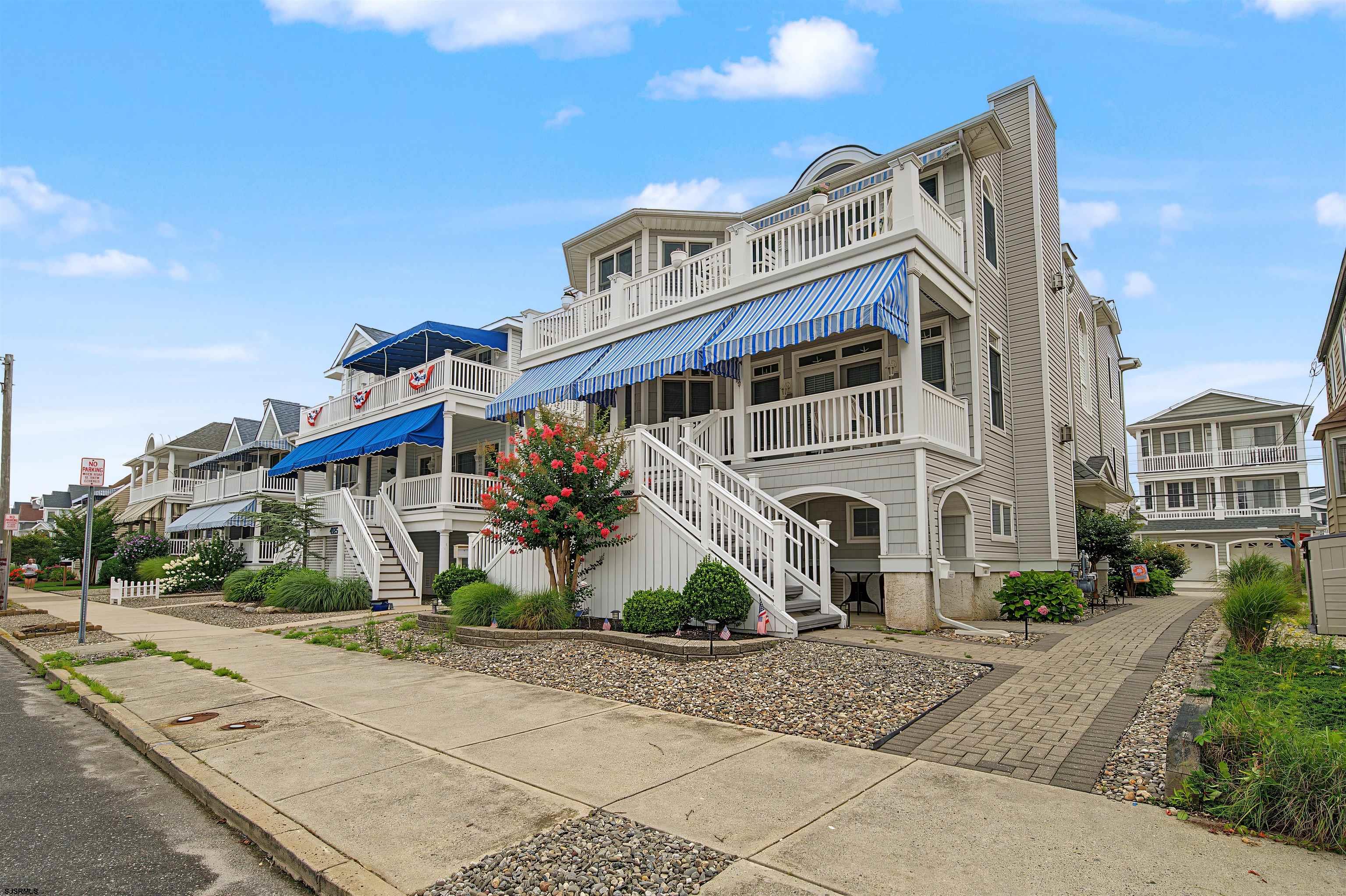 ***PRIVATE ROOFTOP LIVING IN OCEAN CITY'S SOUTH END  Experience the best of the Jersey Shore from this exceptional top-floor 4-bedroom, 2-bathroom residence in Ocean City's sought-after South End. Offering a rare combination of spacious indoor living, private outdoor spaces, an elevator, and impressive ground-level amenities, this home is designed for both relaxed beach living and effortless entertaining.  Step inside to an expansive open-concept Great Room highlighted by dramatic cathedral ceilings, beautiful trim details, and a striking gas fireplace framed by built-in cabinetry. The thoughtfully designed kitchen is ideal for gathering, featuring solid wood cabinetry, quartz countertops, a custom tile backsplash, and a generous center island that serves as the heart of the home.  A private elevator provides convenient direct access from the ground level to the main living area, an uncommon feature that enhances everyday comfort and accessibility. The ground level offers exceptional functionality with parking for up to three vehicles, including an attached garage with an automatic gate and a private parking pad. You'll also find abundant storage, a full shower for convenient cleanup after a day at the beach, and a flexible bonus room with direct access to additional outdoor space.  Outdoor enjoyment continues with a private front deck equipped with a retractable awning, plus the property's standout feature: an exclusive rooftop deck reserved for this top-floor residence. Take in the ocean breezes, unwind beneath the stars, or create your own private setting for morning coffee and evening gatherings.  Whether you're looking for a year-round residence, a personal shore getaway, or an investment property with strong appeal, this Ocean City residence delivers space, privacy, convenience, and distinctive amenities in one remarkable package.  Opportunities to own a top-floor condo with a private elevator, dedicated rooftop deck, and substantial ground-level amenities are truly special. Come see everything this South End property has to offer and make your Ocean City beach lifestyle a reality.