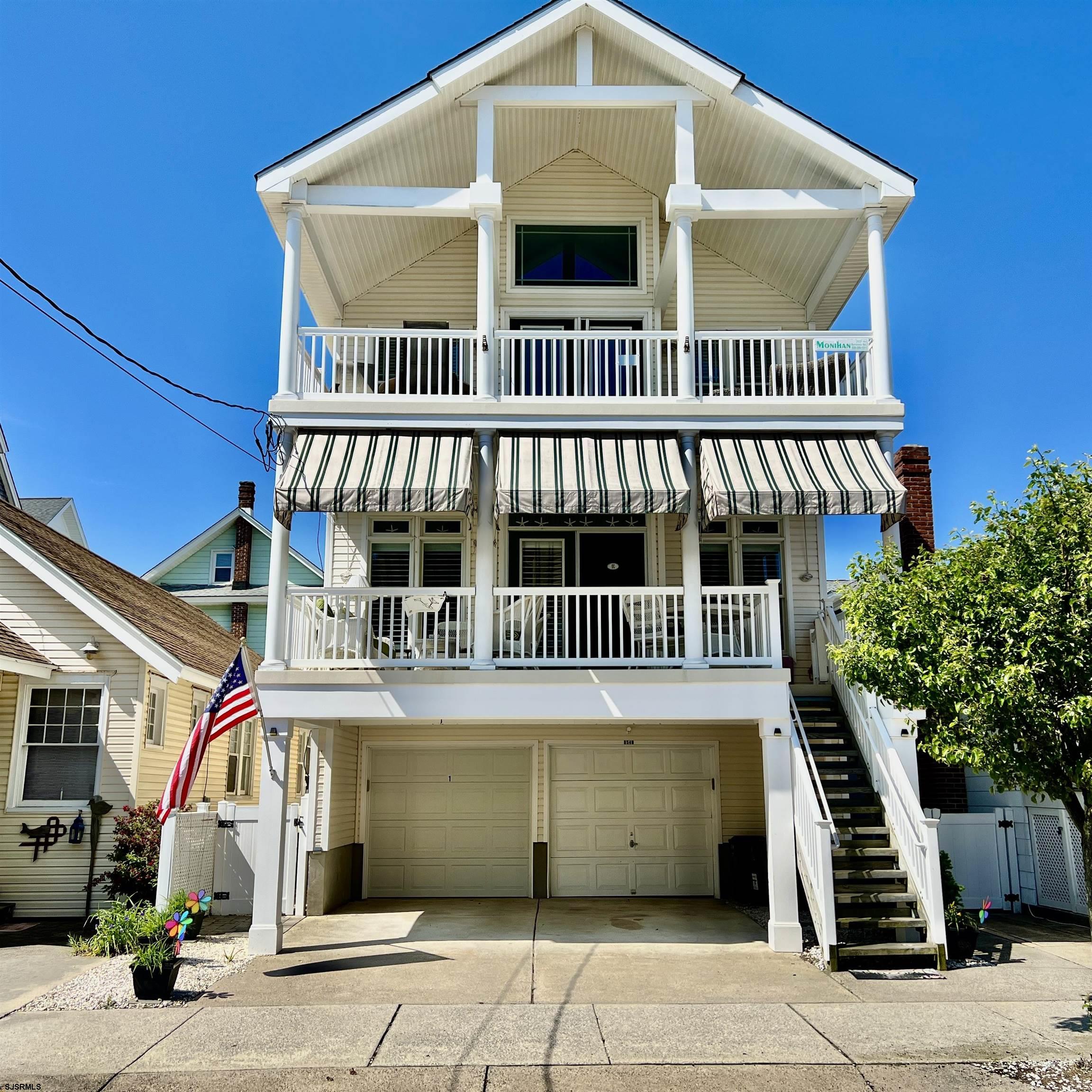OCNJ Northend Condo "BEST BUY" just steps to the beach & boardwalk! This well-maintained beauty features: 3 bedroom, 2 bath 1st floor condo is in excellent condition and ready for its next owners! It features a spacious great room with gas fireplace and a beautiful gourmet kitchen with quartz countertops, subway tile backsplash, newer stainless steel appliances (2022), and large island and dining area. Additional highlights include new laminate wood flooring in the kitchen and dining area (2021), new carpeting throughout (2026), Anderson windows, newer gas heater (2018), newer central air (2019), newer hot water heater (2018), newer front awnings (2018), fresh paint job, new front deck (2020), new electric service (2022), beautiful furnishings and décor, a 2-car garage plus driveway parking, private storage room, enclosed outside shower, landscaped backyard oasis, and more! Amazing location — only 500 feet to the beach & boardwalk! Great property in mint condition with outstanding rental potential and exceptional value. Schedule your showing today! Great Location! (steps to beach & boardwalk) Great Property! (mint condition) Great Value! See you on the Beach!