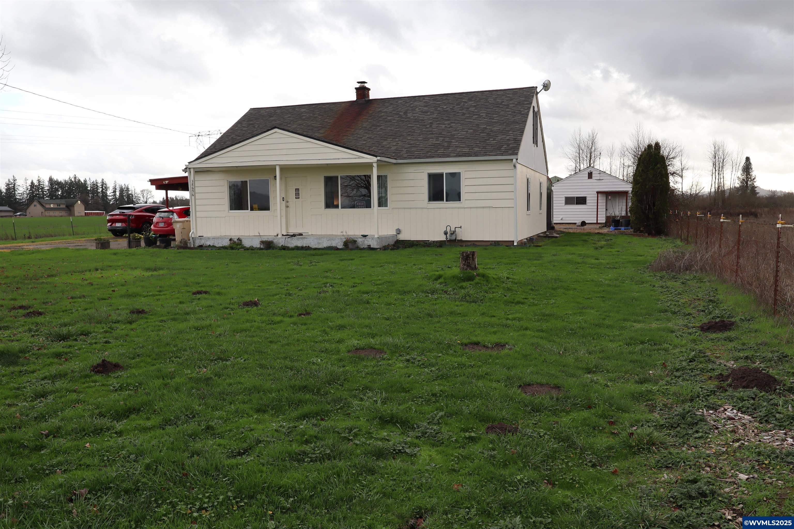 Accepted Offer with Contingencies. Own your own farm in the mid valley. Endless possibilities. New roof in 2020 on this 2 story cottage. Wood floors and peninsula kitchen with stainless appliances. Large living room heated by wood stove. Detached garage has shop space and separate entrance to a large laundry room. Barn has loft hay storage, Stansion and stall for your critters. Separate lean too off barn and garage for additional storage. Almost 15 acres fenced and cross fenced and seasonal pond. Unbelievable sunsets and opportunities