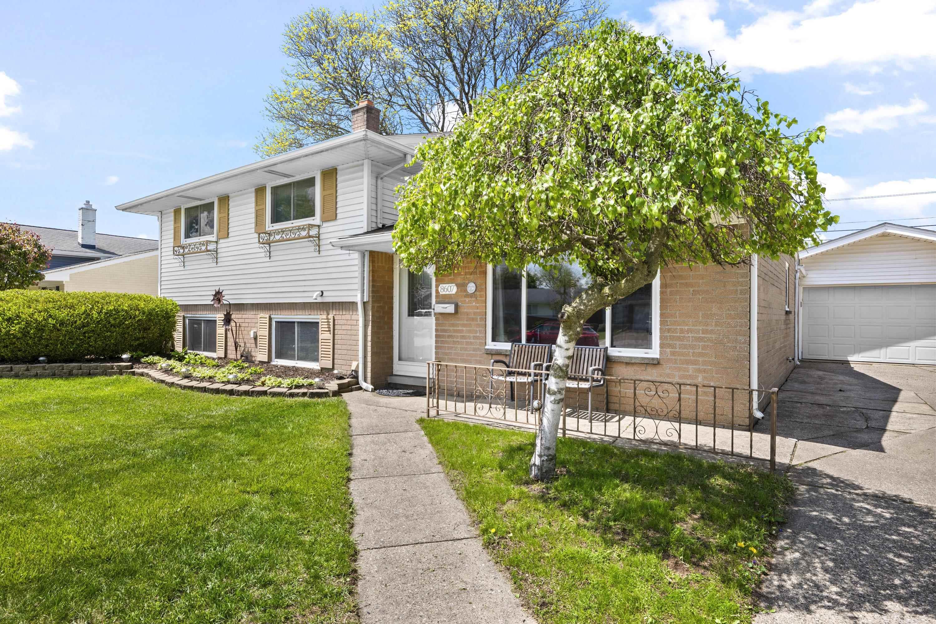 Nestled in a quiet, sought-after pocket of North Sterling Heights, this meticulously maintained 4 bdrm, 2 bthrm, tri-level offers the perfect blend of space & serenity. Backing to open space with no rear neighbors, the fenced backyard is a private oasis featuring a fun raised fort. Inside, fresh neutral paint & new plush carpet fill the sun-drenched living rm, flowing into a bright kitchen with a snack bar with opening adjacant to a spacious dining rm. The upper level features 4 spacious bdrms with beautiful hardwood floors & a full bath. The lower level offers a newly carpeted 2nd family rm & a versatile flex rm with a seperate entry door to side yard, next to a remodeled full bath with subway tile. Hobbyists will love the 2.5-car attached mechanic's dream garage with a deep workshop bump-out. With prime access to M-59 & a location in the award winning Utica Community Schools, this home delivers the ultimate combination of privacy, functionality & convenience. Updated light fixtures throughout most of the home. Kitchen and Laundry rm appliances included.