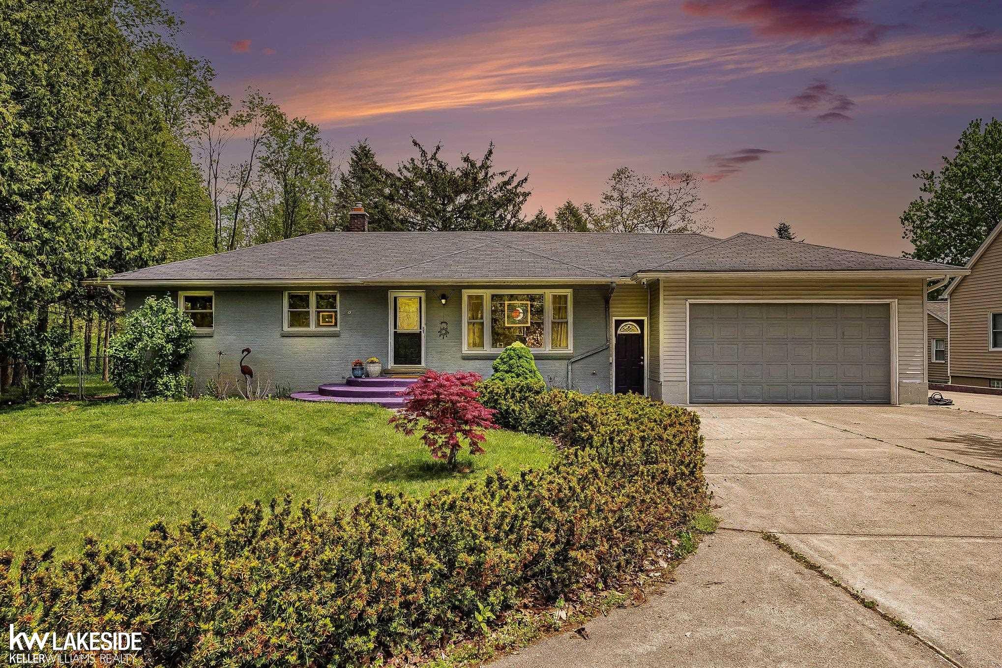 **OPEN HOUSE SATURDAY 5/16 12-3PM** Rare opportunity to own a one-of-a-kind property that blends comfortable country living with an extraordinary commercial-grade outbuilding on approximately 2 private, tree-lined acres. The 2,000 sq ft ranch home features 4 bedrooms, an attached 2-car garage, and a stunning master en suite with custom-crafted stained glass cabinetry. Inside, you'll find a spacious living room with dual skylights, a stone fireplace, and laminate flooring. The gourmet kitchen impresses with rich oak cabinetry, granite countertops, tile backsplash, center island with seating, and pendant lighting. A charming library/dining room wrapped in floor-to-ceiling bookshelves and stained glass accents adds a truly unique touch rarely found in any home. Finished basement with recessed lighting for additional living space or storage. Step outside to a beautifully landscaped yard with a brick paver patio, raised garden beds, birdbath fountain, and a sweeping weeping willow. The backyard deck and mature hardwoods create a private outdoor retreat. Furance and AC 2020.     THE OUTBUILDING IS WHERE THIS PROPERTY TRULY SHINES. This massive 60' x 40' pole barn was engineered and built to full residential standards, permitted by the city, and operates completely independently from the main house with its own 200-amp electrical service, city water, full septic system (sized for a 3-bedroom home), and its own winterizable utility systems. Constructed by USA Discount Lumber with concrete work by Griffin Cement, the slab is approximately 6" thick under the RV and car lift areas, and 4" throughout the remainder. The structure features three distinct bays (12x12.5x60, 14x10x60, and 16x16.5x60), six overhead vehicle doors - including three powered 14x14 and 8x9 doors on both the east and west sides - allowing full drive-through access. A professional-grade 2-post car lift with 7,000 lb capacity conveys. Comfort is built in: the floor is equipped with hydronic radiant heat in 3 zones (Slant/Fin electric boiler), and a full H