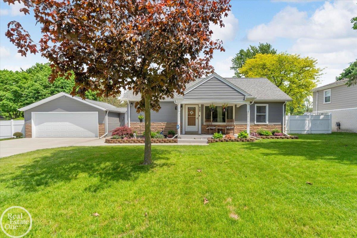 This spring's hottest sizzler! Outstanding Shelby Twp 3-bedroom home nestled on a wide double lot. The moment you walk in, you'll fall in love with this gem and all the recent updates, including the kitchen, bathroom, flooring, and fresh paint. Major updates completed within the last few years include the furnace, roof, hot water tank, driveway, siding, eaves, and patio-leaving nothing to do but move in! All appliances stay. Enjoy the open floor plan, quiet private backyard with three gorgeous pear trees, and a massive patio with a custom fireplace-perfect for entertaining or relaxing in your own outdoor retreat. This rare find will not last long, so bring your deposit check-you'll need it!