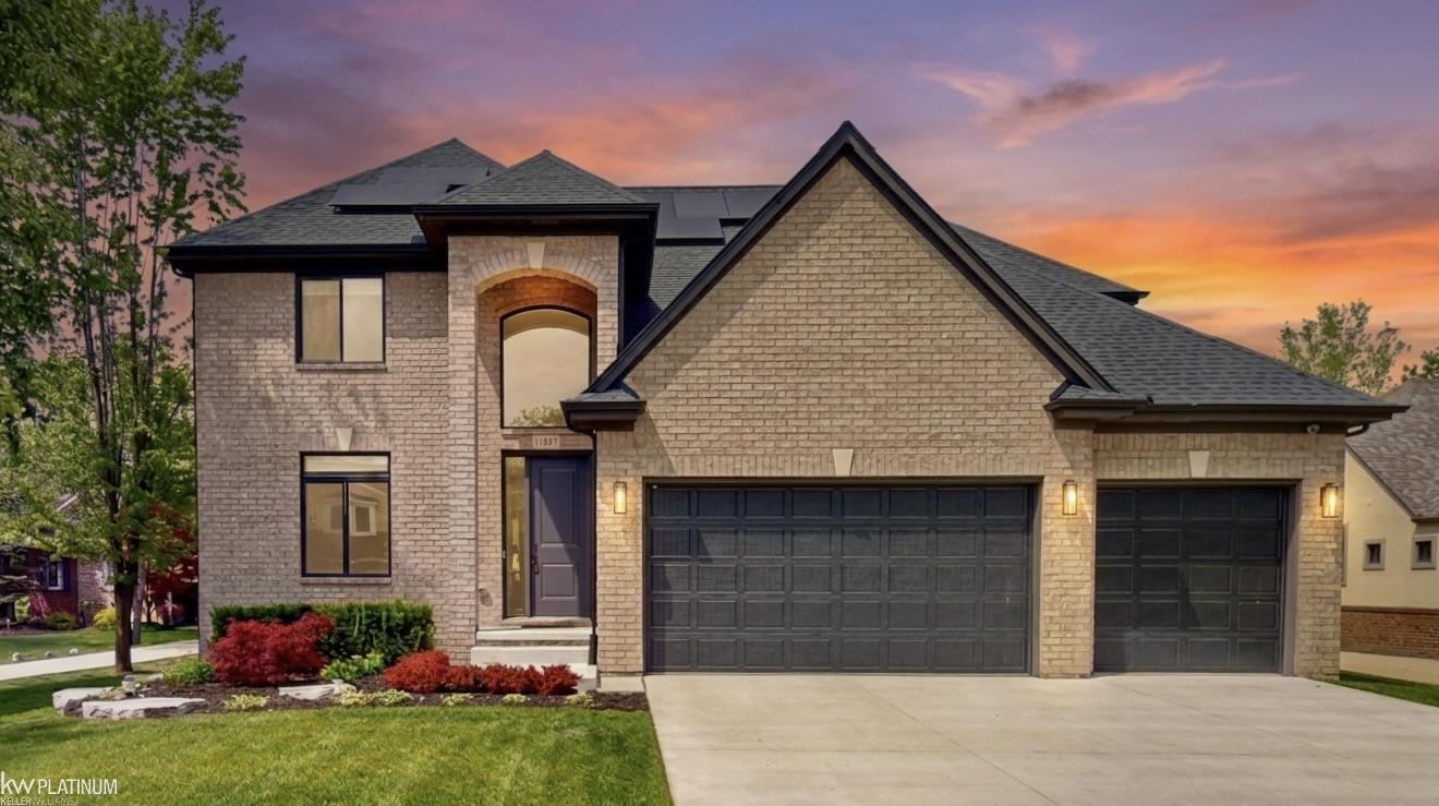 *OPEN HOUSE! SATURDAY 5/23 11:00-1:00* Better-than-new luxury living in Liberty Woods. Built in 2023 by Caliber Homes, this stunning 4-bedroom, 3-bath colonial offers 2,862 sq ft of thoughtfully designed living space with over $90,000 in premium post-construction upgrades already completed.  The open-concept main level features a gourmet kitchen with custom Lafata Cabinets, quartz countertops, oversized island, upgraded high-end appliances, and a spacious great room with gas fireplace and wood beam details. A private library adds flexible space for a home office or study.  Upstairs, the luxurious primary suite offers a spa-like bath with soaking tub, oversized shower, dual vanities, and large walk-in closet, along with three additional bedrooms and convenient second-floor laundry.  Extensive upgrades include professionally designed landscaping, epoxy-coated garage and patio surfaces, smart-home lighting throughout, and a beautifully designed outdoor retreat with covered loggia and separate fire pit patio.  Fully paid-off built-in solar offsets approximately half of annual electric usage, even while supporting EV charging and hot tub operation.  The unfinished basement includes egress access and roughed-in plumbing, offering exceptional future potential. Located in the highly regarded Romeo Community Schools district with community walking trails, this home offers all the benefits of new construction with every upgrade already complete!